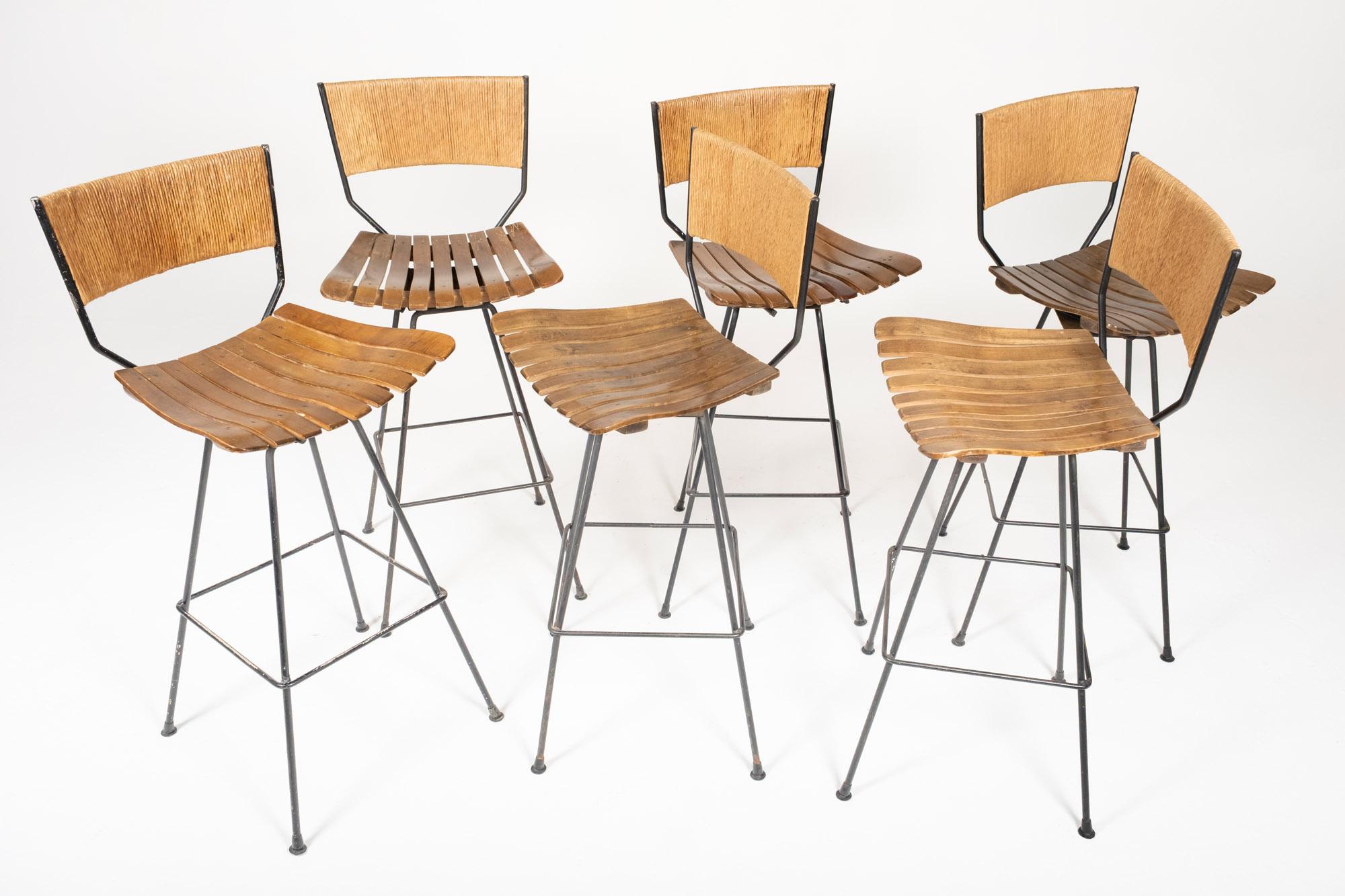 Set of 6 Arthur Umanoff Swivel Seat Bar Stools in Slatted Wood, Raffia, & Iron In Good Condition For Sale In Los Angeles, CA