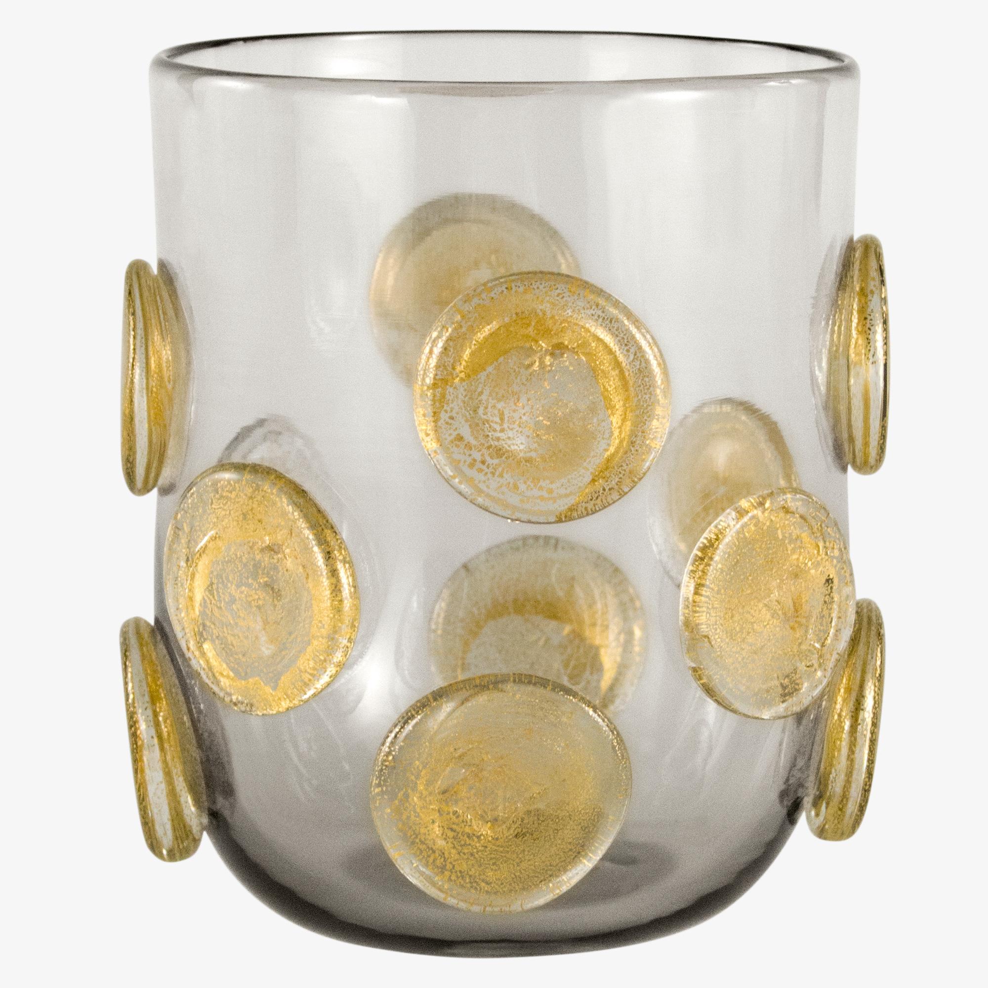 These artistic glasses are handmade by the master artisan in grey color with golden leaf round applications.
Every piece differs one from the other.

Precious pieces that can enrich every table.

The handcrafted soul of our lighting products is