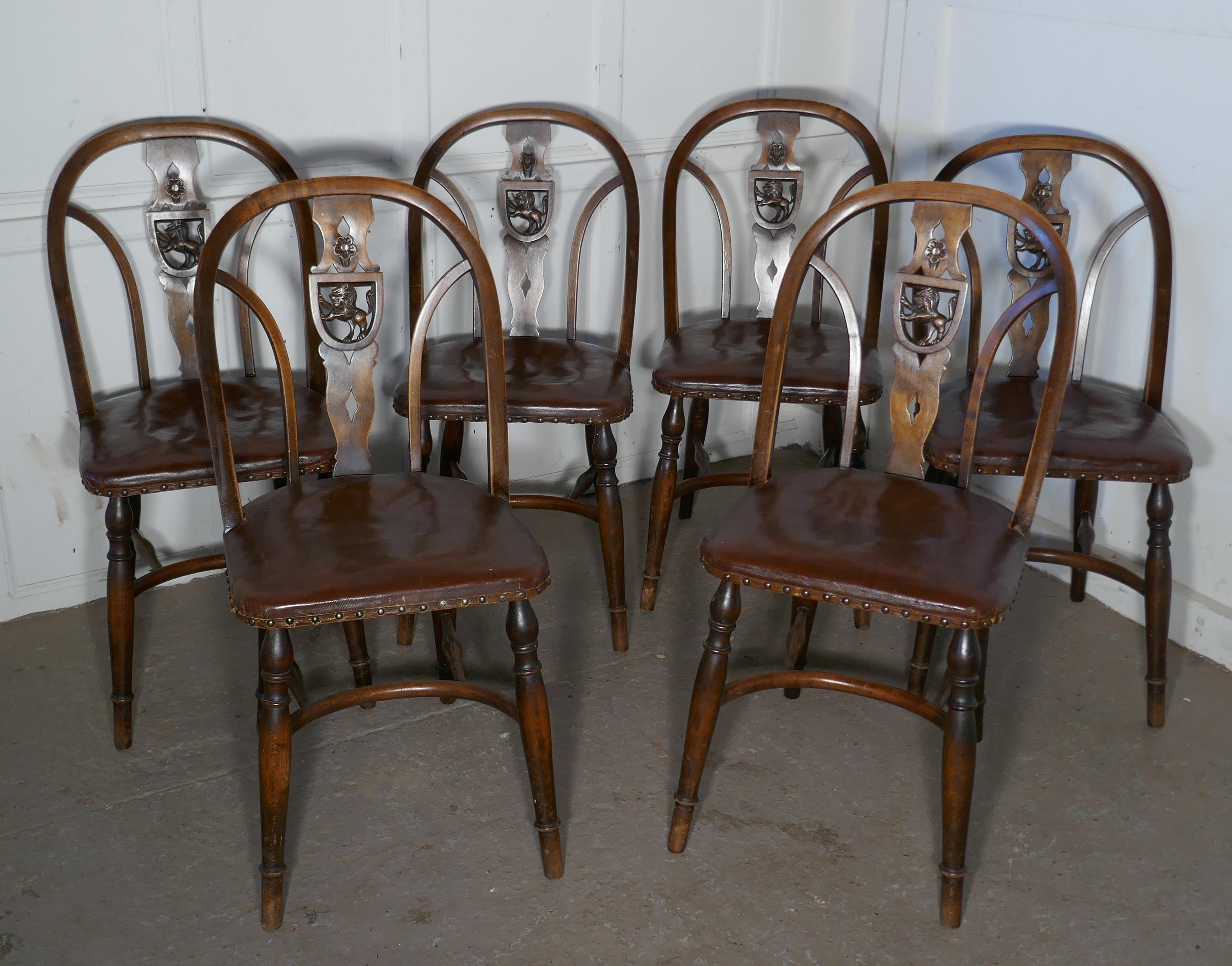 Set of 6 Arts & Crafts Gothic Heraldic lion back Windsor chairs.

A very unusual set of Windsor chairs, the centre splat of each chair has Gothic shield carved with a Rampant lion in the centre
The chairs are good Arts & Crafts pieces with