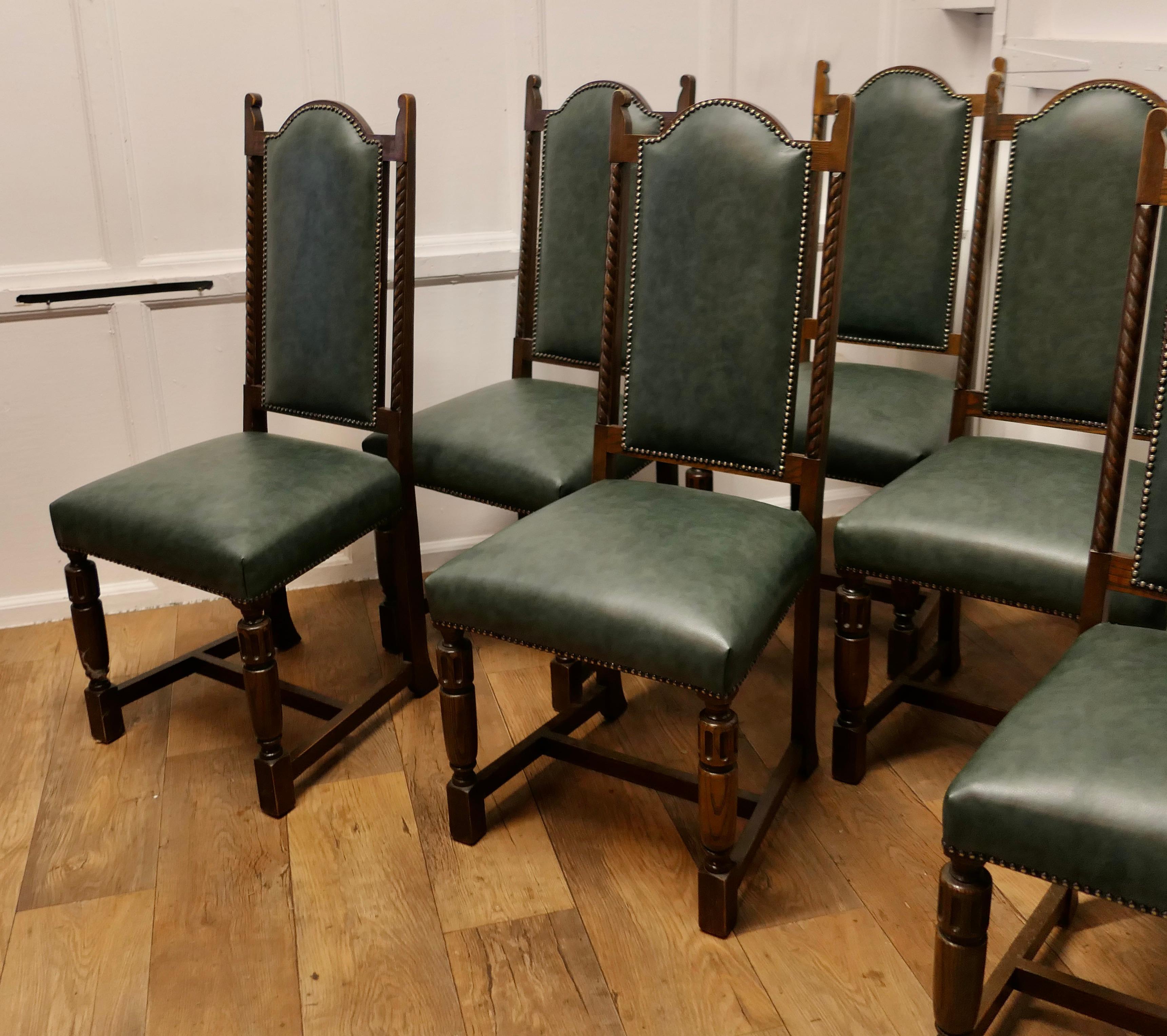 Set of 6 Arts and Crafts Gothic Oak Leather Dining Chairs

This is a good set of Arts and Crafts Dining Chairs, they are in the gothic style with high backs and barley twist carving
The chairs have turned legs and are upholstered back and front in