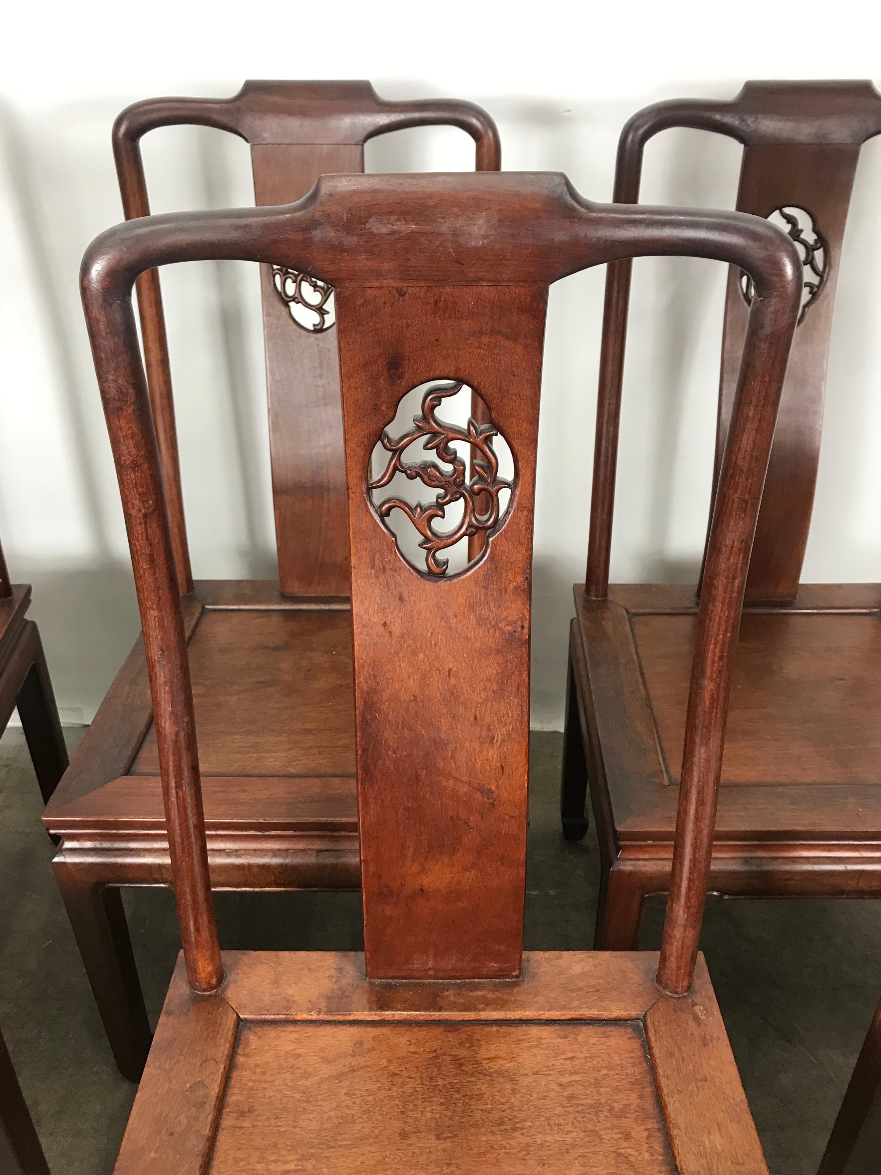 An exceptional set of six Chinese solid carved rosewood dining chairs. The chairs feature solid rosewood construction with beautiful wood grain and nice carved details. solid, sturdy and well built, extremely comfortable, look amazing with modernist