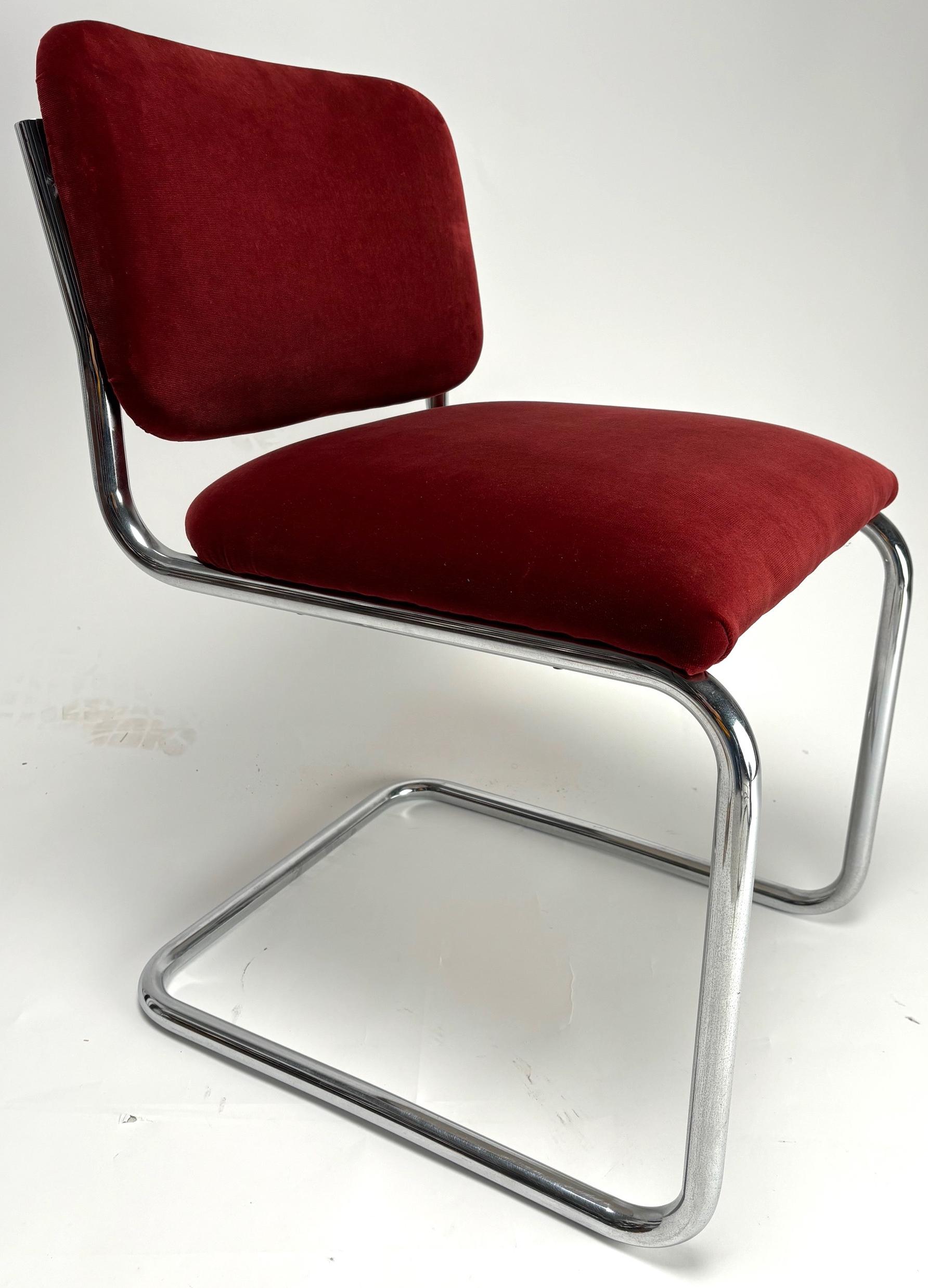 Set of 6 beautiful B32 chairs designed by the famous architect and designer Marcel Breuer. 

These are the original chairs, made by Gavina in the 80s and reupholstered in a beautiful red velvet.

2 more identical chairs with slight defects in the