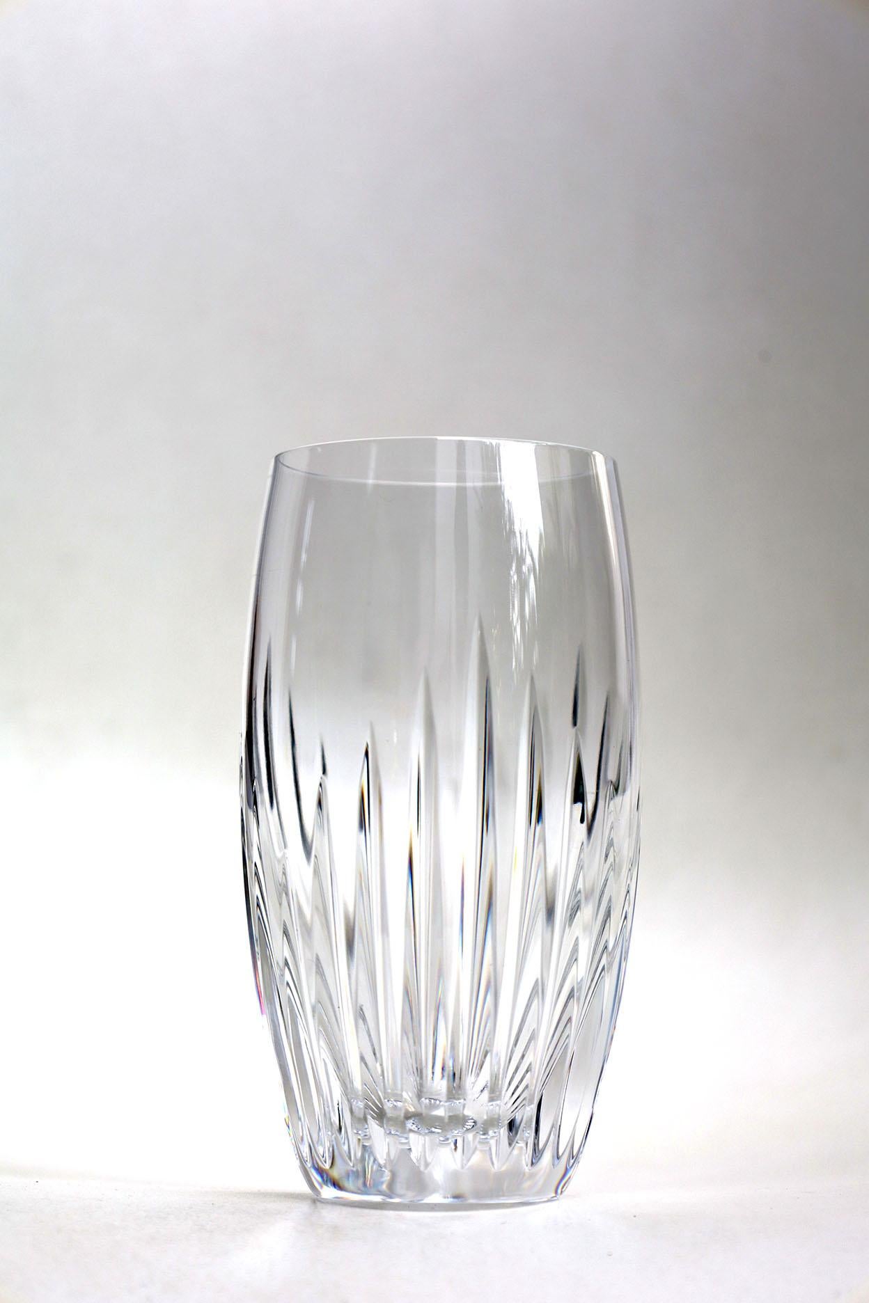 The intricate detailing gives the Massena glass the appearance of impressive heft, as if it were a modern-day chalice. The polished silhouette and prismatic qualities make it worthy of any festive occasion or special soirée. The glass is just one