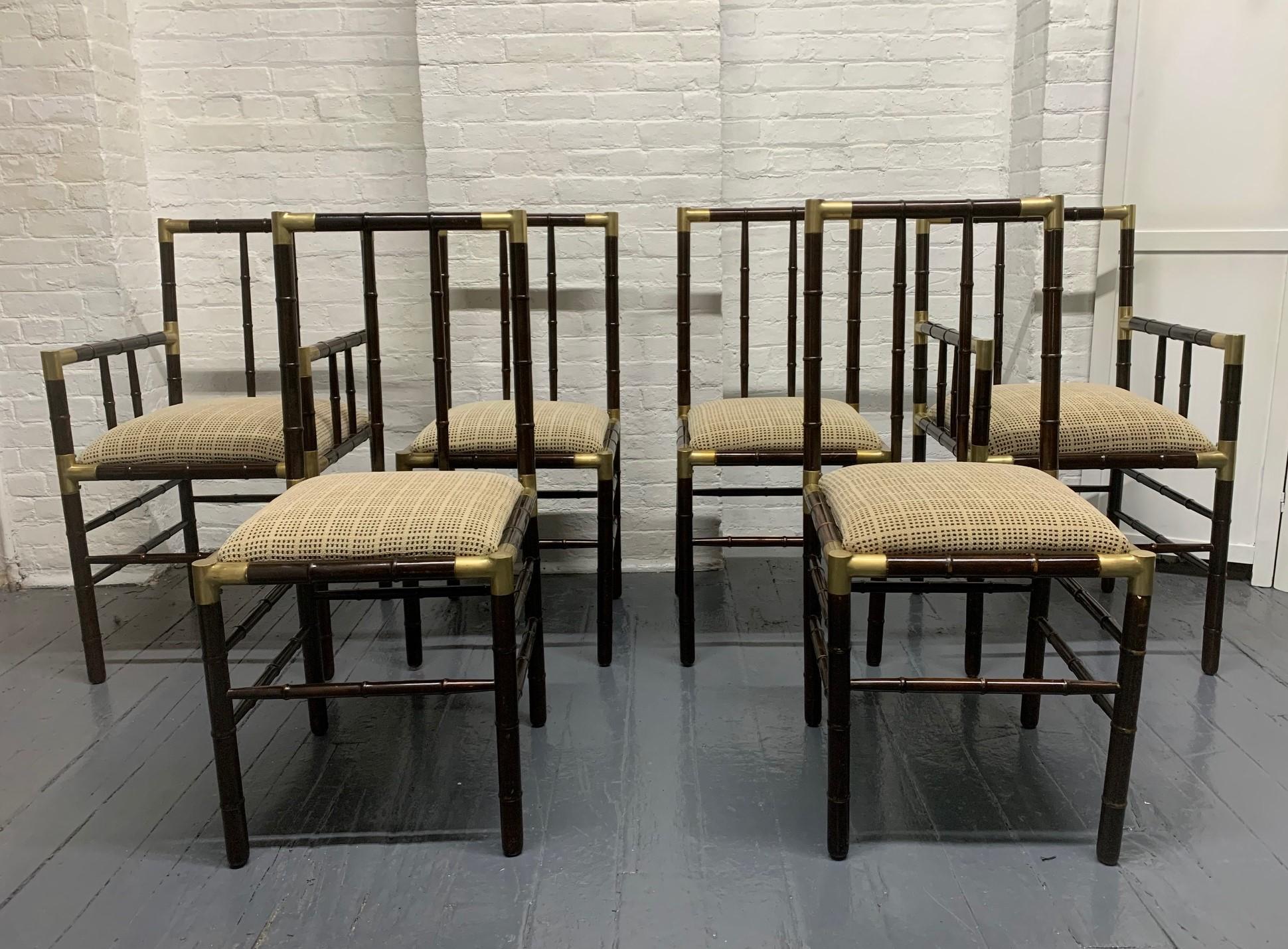Set of 6 faux bamboo dining chairs with brass trim attributed to Billy Haines. Set contains two armchairs.
Measures: Armchairs 35.5 H x 20 W x 21 D, seat height 22
Side chairs: 36.5 H x 17 W x 18 D, seat height 20.