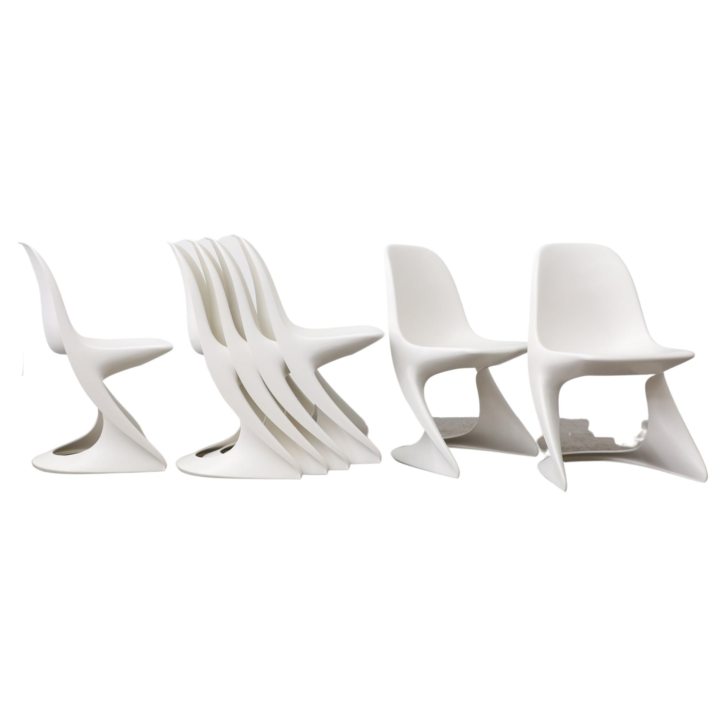 Set of six 1970's white plastic stacking Casalino chairs by Alexander Begge. In original condition with visible wear, including scratching. Two sets of 6 in white available, also available in red, green and black, listed separately (S056).