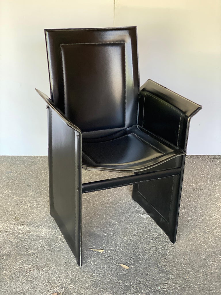 Tito Agnoli for Matteo Grassi, set of six armed Korium dining chairs or conference chairs in black leather. Very comfortable and in beautiful condition. Italy, 1970's-80's.