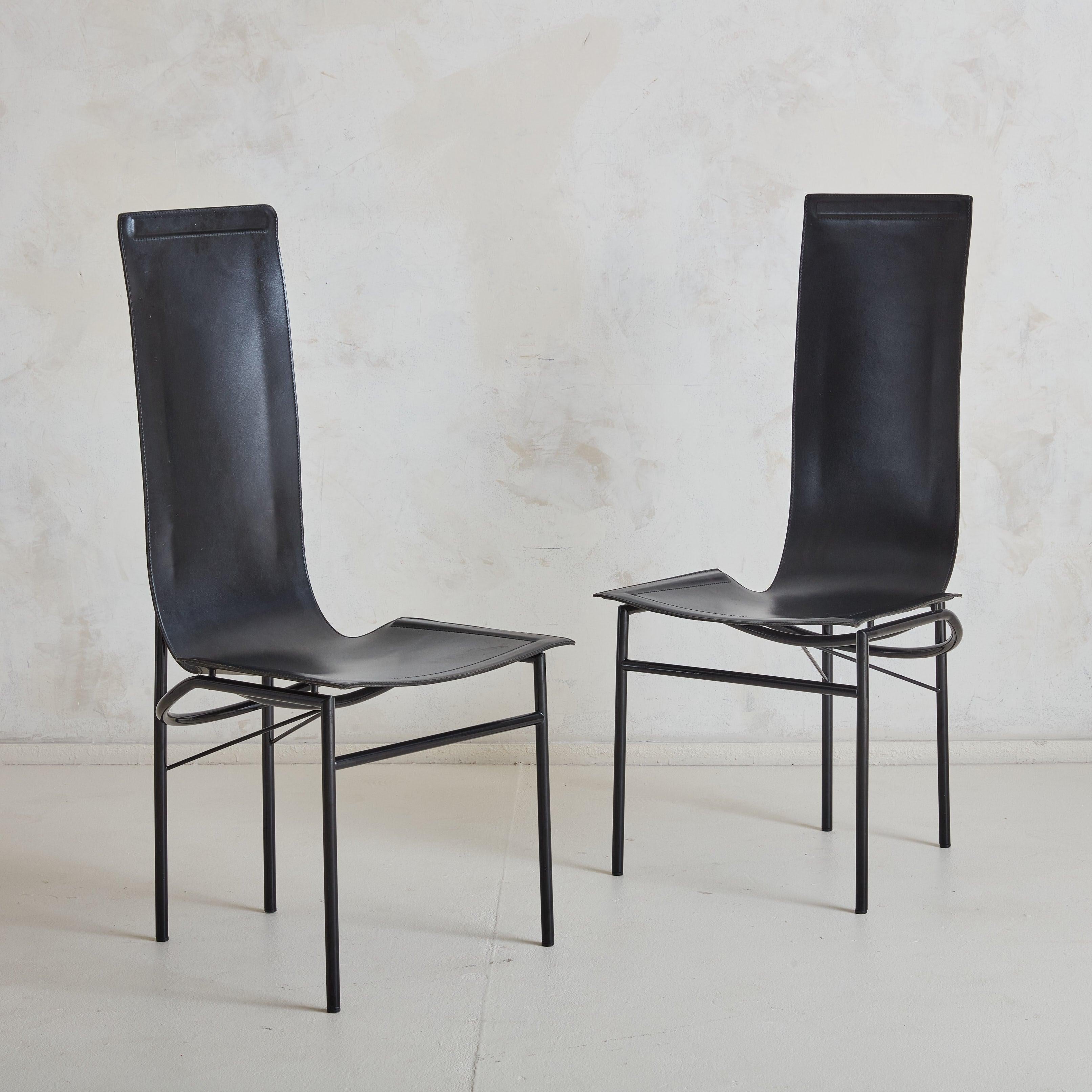 A set of 6 1980s black leather dining chairs, channeling the sculptural minimalism that defines Adalberto del Lago's work for Misura Emme. These chairs embody the essence of modern Italian craftsmanship, featuring a sleek, black leather sling that