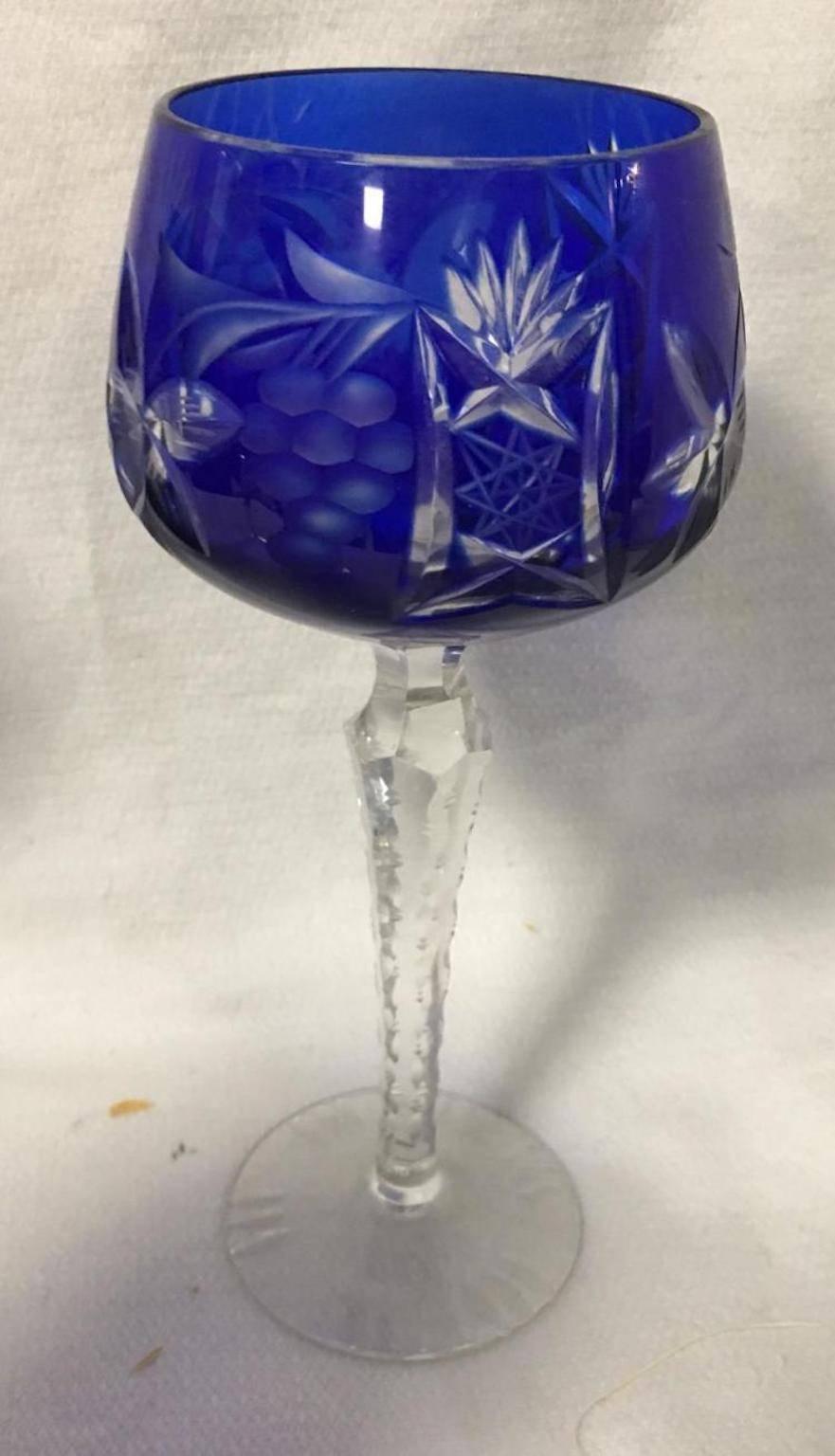 Set of six decorated blue cut to clear wine glasses.