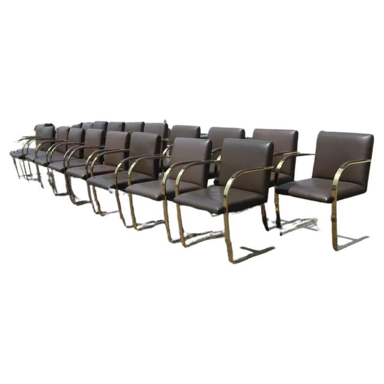 A vintage Brno chair designed by Mies van der Rohe. These chairs were a special order with bronze flat bar frames for a prominent law firm in Texas.

Reupholstery is recommended.