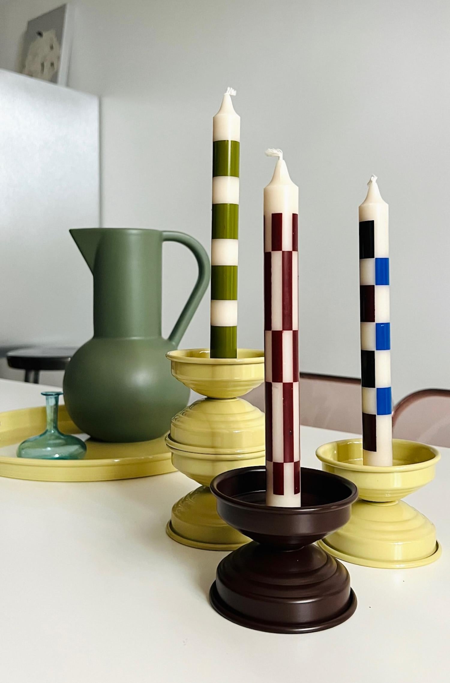 Handcrafted in Italy, this set of 6 candlesticks features a sculptural minimalist design with a rich, matte chocolate finish. Made from hand-painted aluminum, each piece has a velvety, non-reflective surface that lends warmth and understated