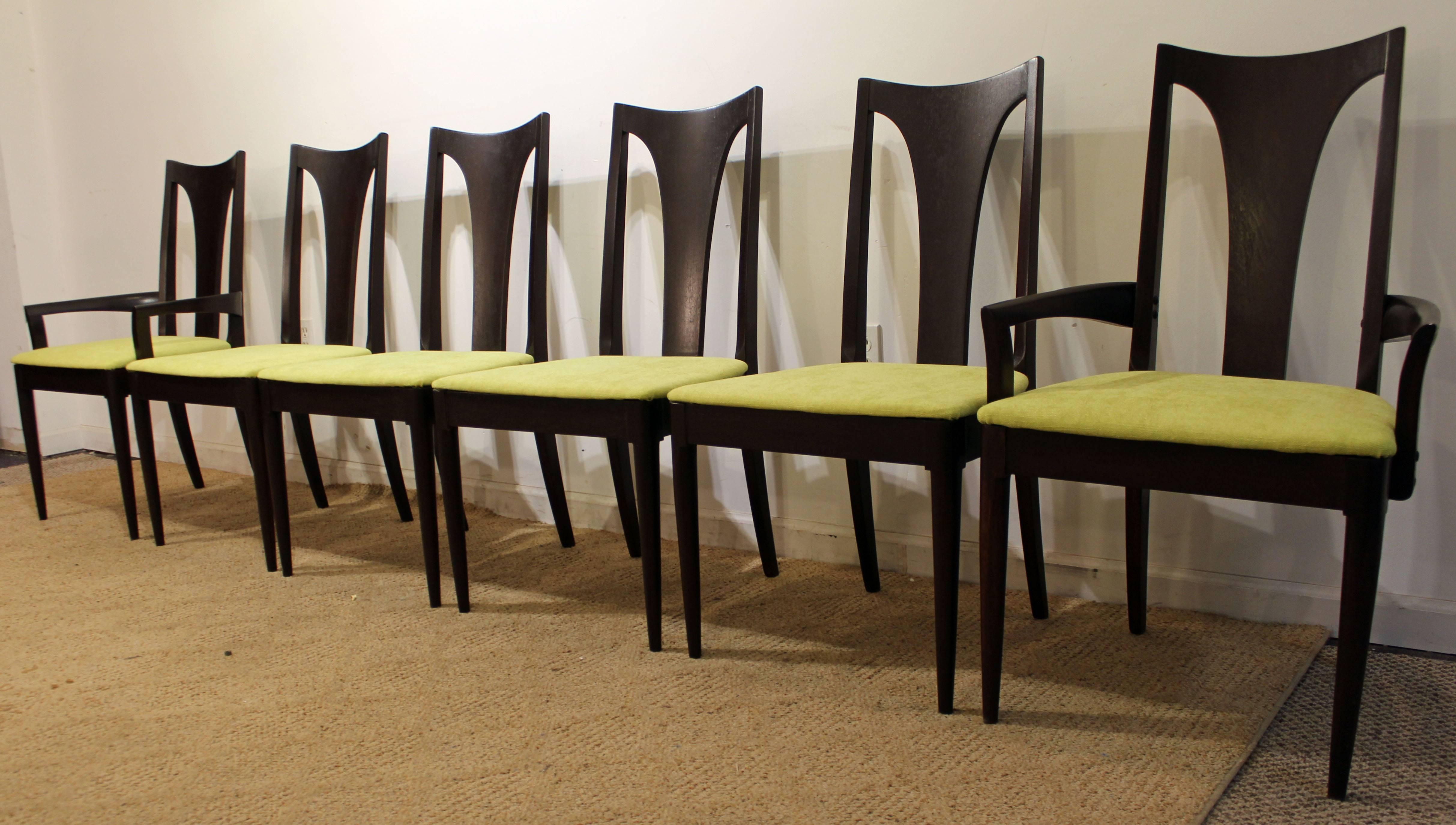 Offered is a set of six dining chairs by Broyhill Brasilia. This set includes four side chairs and two arm chairs. They have been refinished with a dark walnut stain and have been reupholstered with 'Citron' fabric.

Approximate dimensions:
Arm