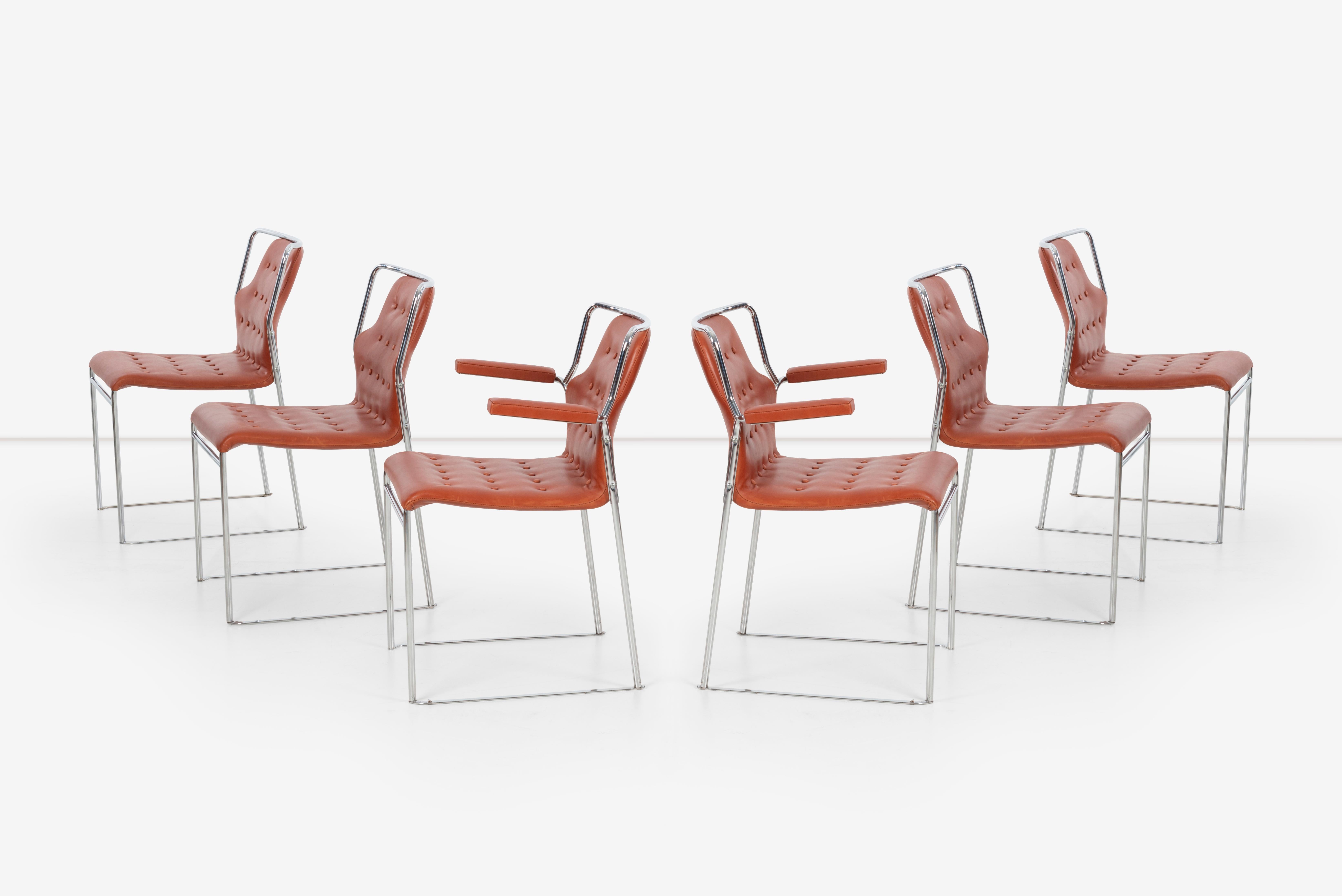 Set of 6 dining chairs upholstered with Edlemen leather and chrome plated frame. Arm chairs have a width of 24.5