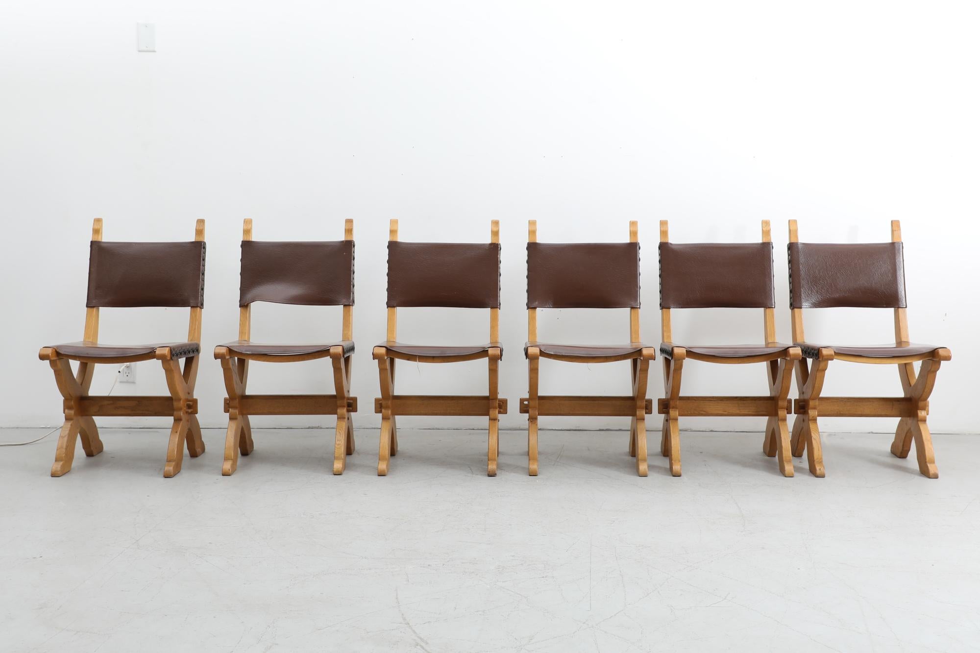 Brutalist dining chairs, Dutch design by Bram Sprij for Sprij Meubelen Holland from the 1960s. Solid Oak frame and leather seating. The chairs have an attribution mark. In original condition with visible wear consistent with their age and use.