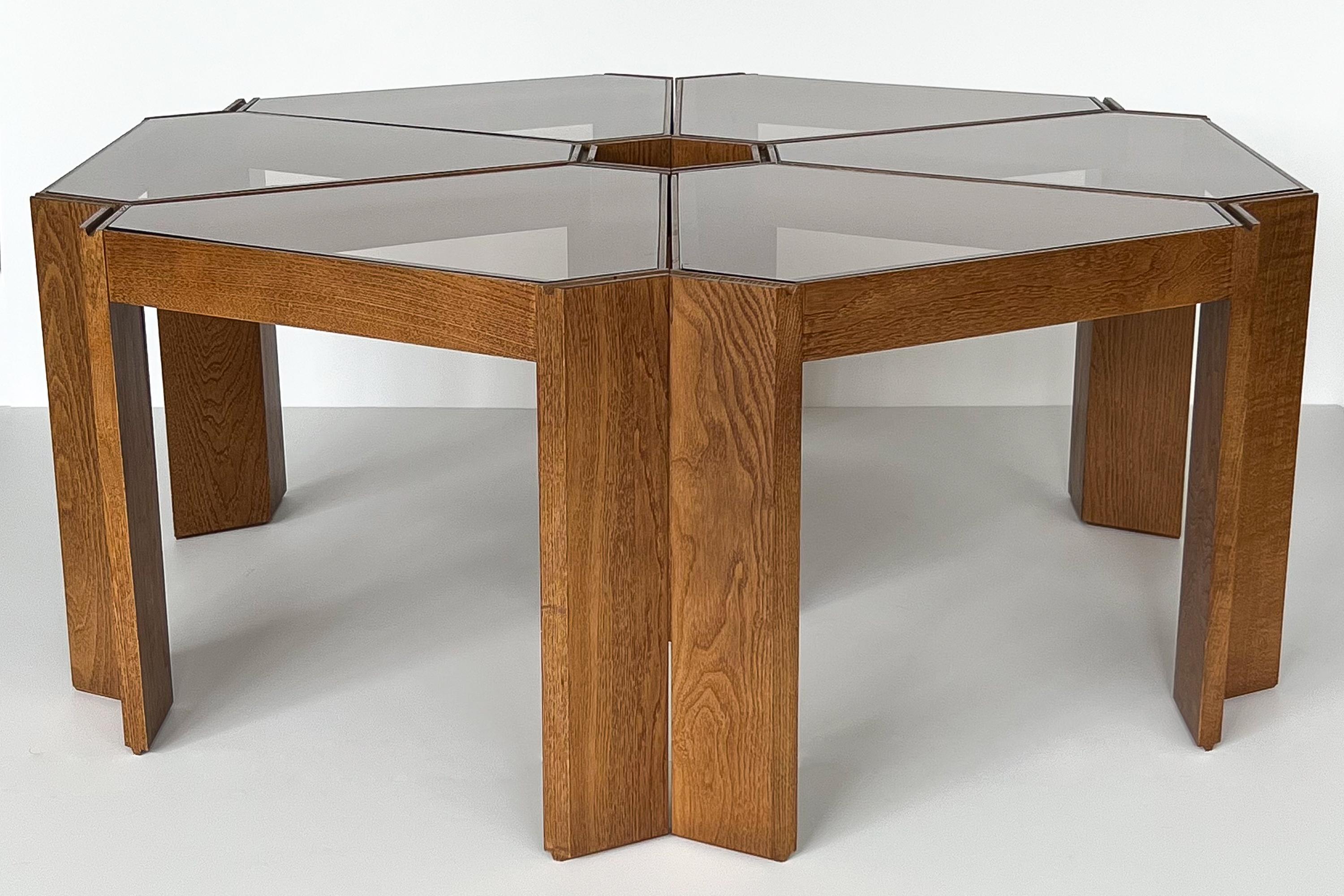 Set of six Italian bunching multi functional modular tables in the style of Frattini, Italy circa 1970s. This set of tables is perfect as a modular coffee table. Six triangular pie shaped individual side tables can be placed together in various