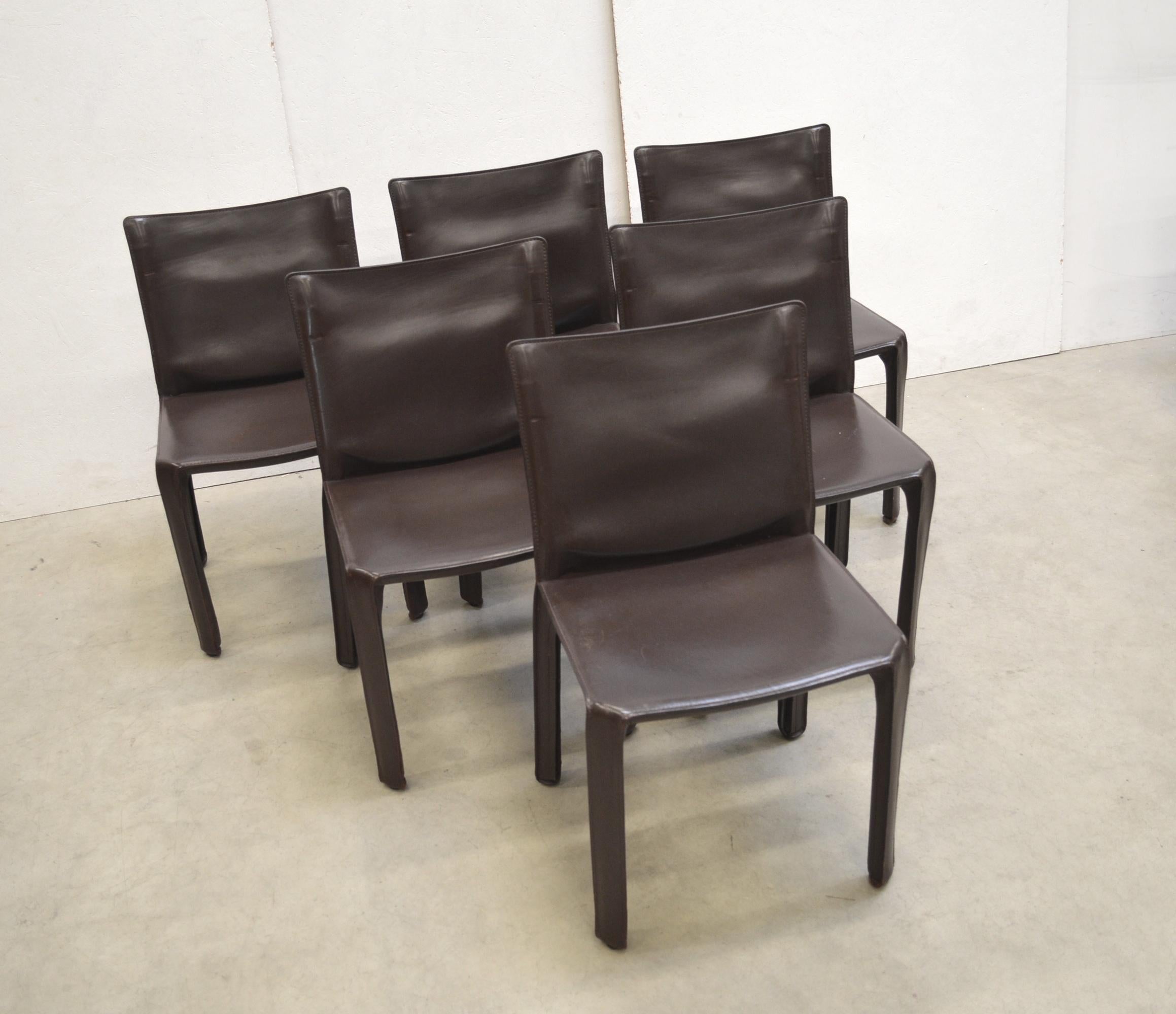 Set of 6 iconic cab chair model 412 by Mario Bellini for Cassina.
Original made in Italy.

Full Chocolate brown saddle leather which comes in nice condition with light patina.

Timeless design pieces. Maker's label on bottom of seat.
Overall