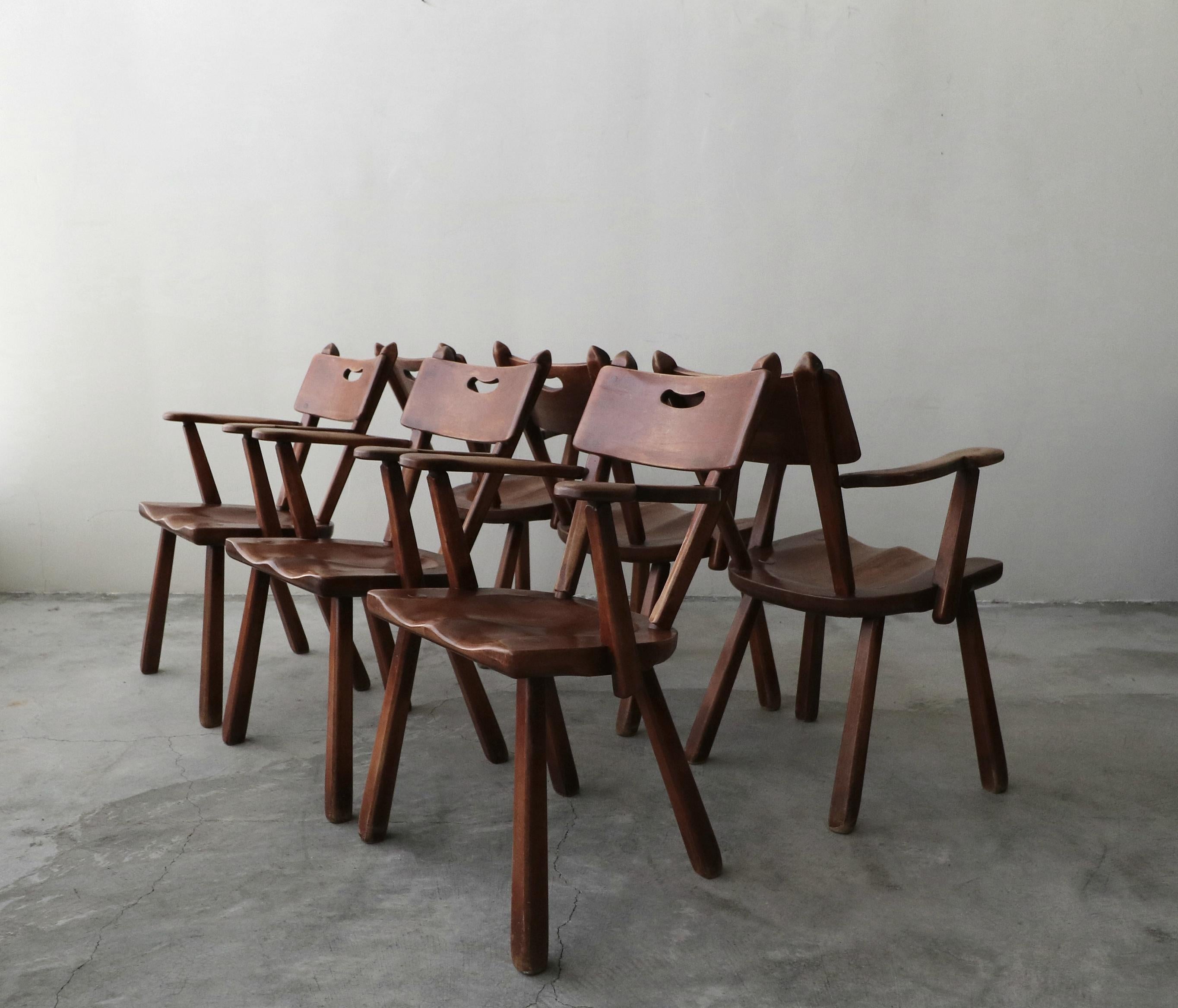 One of a kind set of handcrafted, midcentury Studio Craft chairs signed.

Constructed of solid wood and joined with dowels. Seamless construction, with beautiful lines, a truly unique set. Have a knack for the unique, love having pieces that no