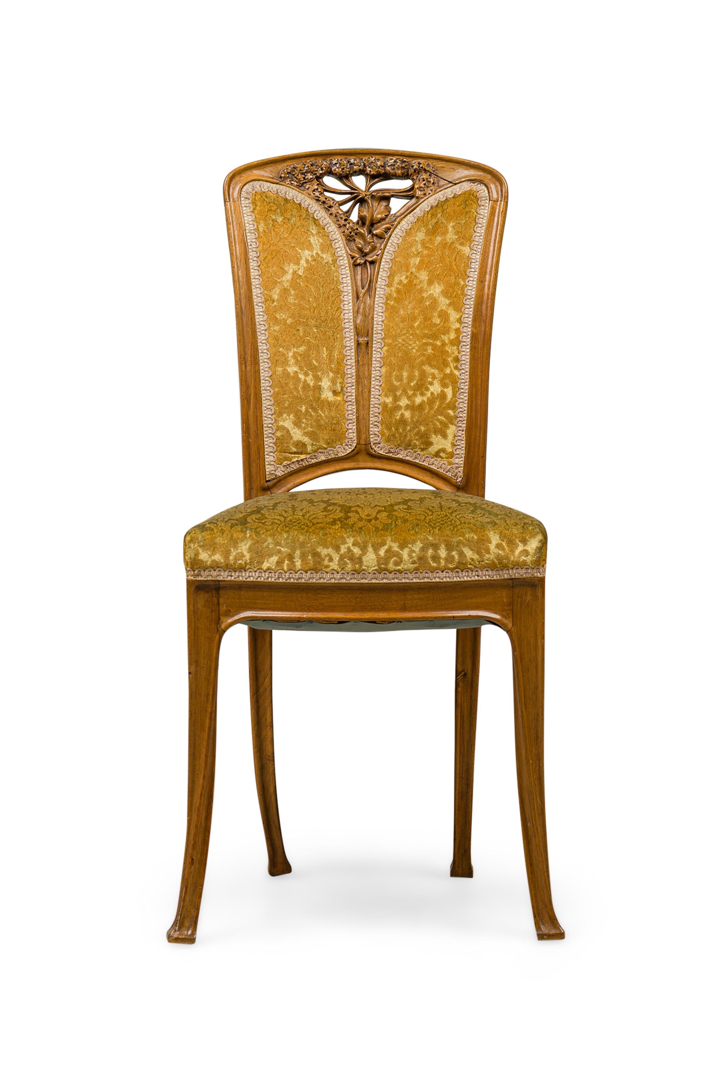 SET of 6 French Art Nouveau side chairs with the backs having a centered carved ombelle and foliate reticulated frame (NOTE: 2 upholstered in a gold velvet damask, 4 unupholstered) (PRICED AS SET)(CAMILLE GAUTHIER)
 

 4 chairs are frame-only,