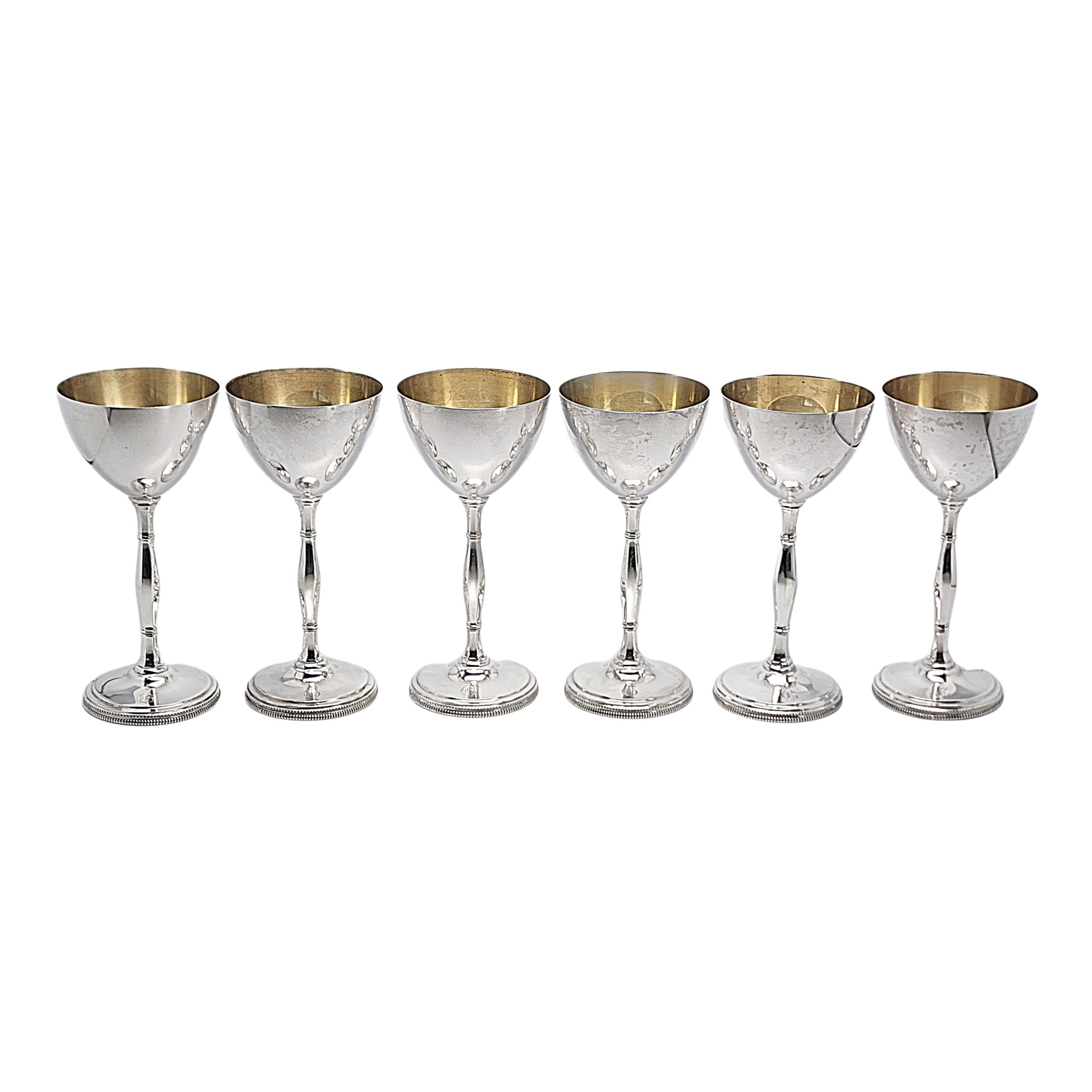 Set of 6 sterling silver champagne or cocktail chalice/goblets by Cartier.

Engraving appears to be the letter G on the base of each goblet (see photo).

A simple and classic polished design with gold wash interior bowl. Long stem and shallow cup.