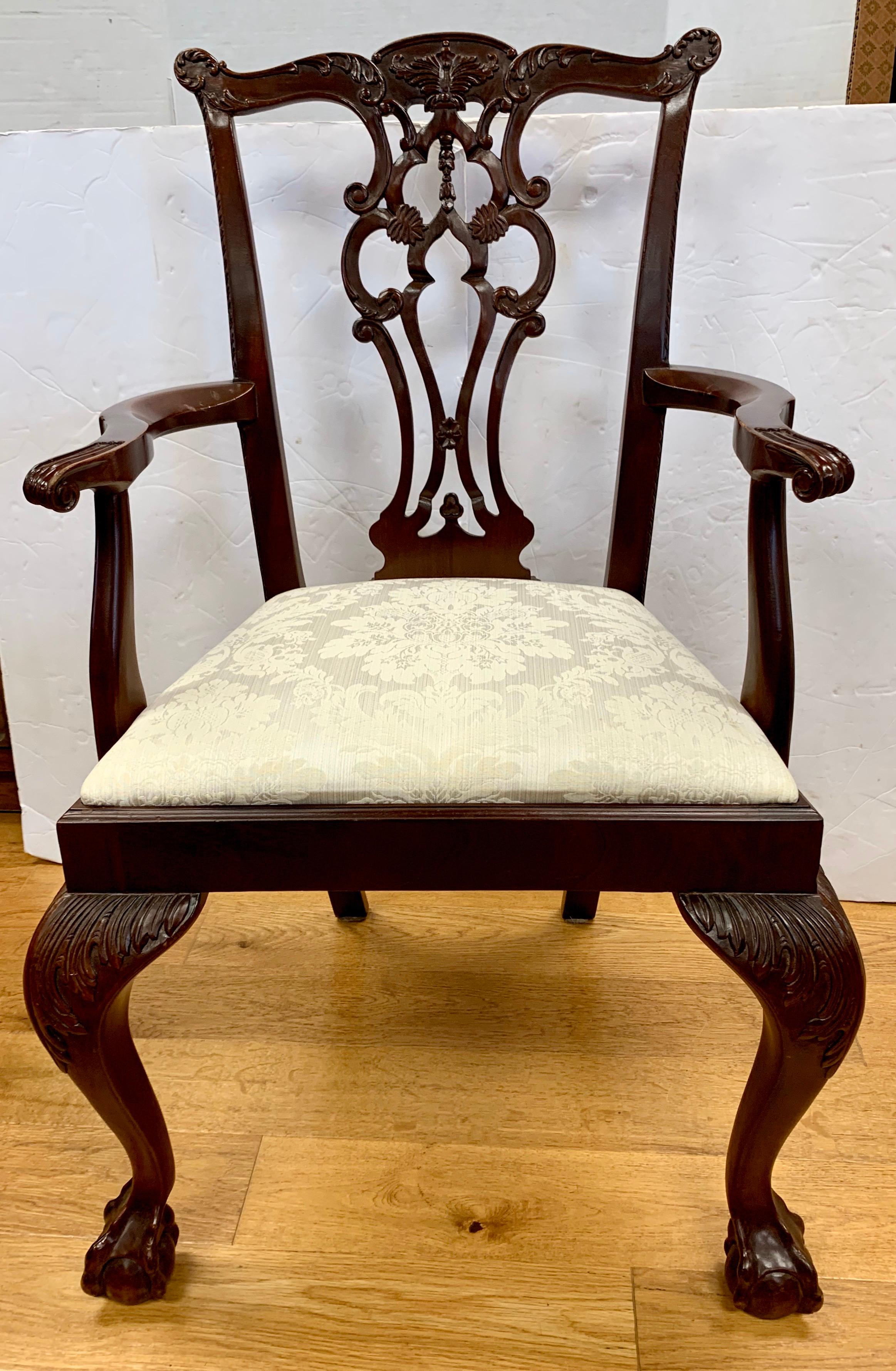 A beautiful vintage set of six solid mahogany Chippendale dining chairs with ornate carvings all around. Consists of four side chairs and two armchairs with ball and claw feet.
They have been crafted from hand carved solid flame mahogany with drop