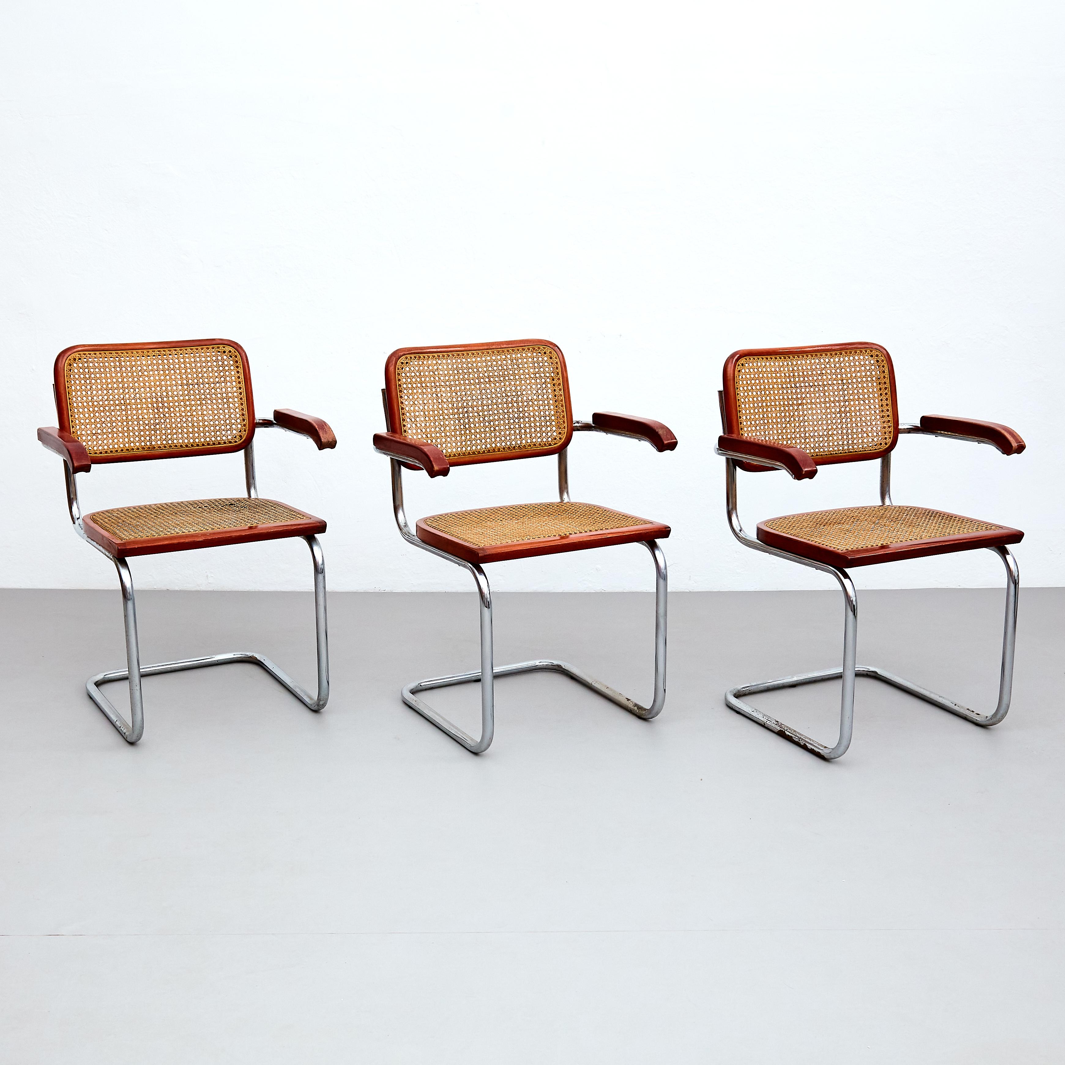 Introducing this exceptional set of 6 Cesca chairs, designed by the renowned Marcel Breuer and manufactured in Italy, circa 1960. These iconic Mid-Century Modern chairs showcase a perfect harmony of materials, featuring metal pipe frames, wood seat
