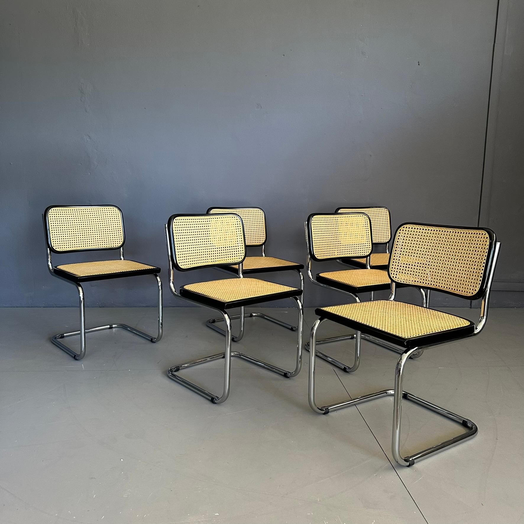 Set of 6 CESCA chairs, model B32, design by Marcel Breuer for Gavina, Italian manufacture from the seventies.
Chromed tubular steel structure, straw back and seat with black stained beech profiles. The straw is new.
On the back of the seat you can