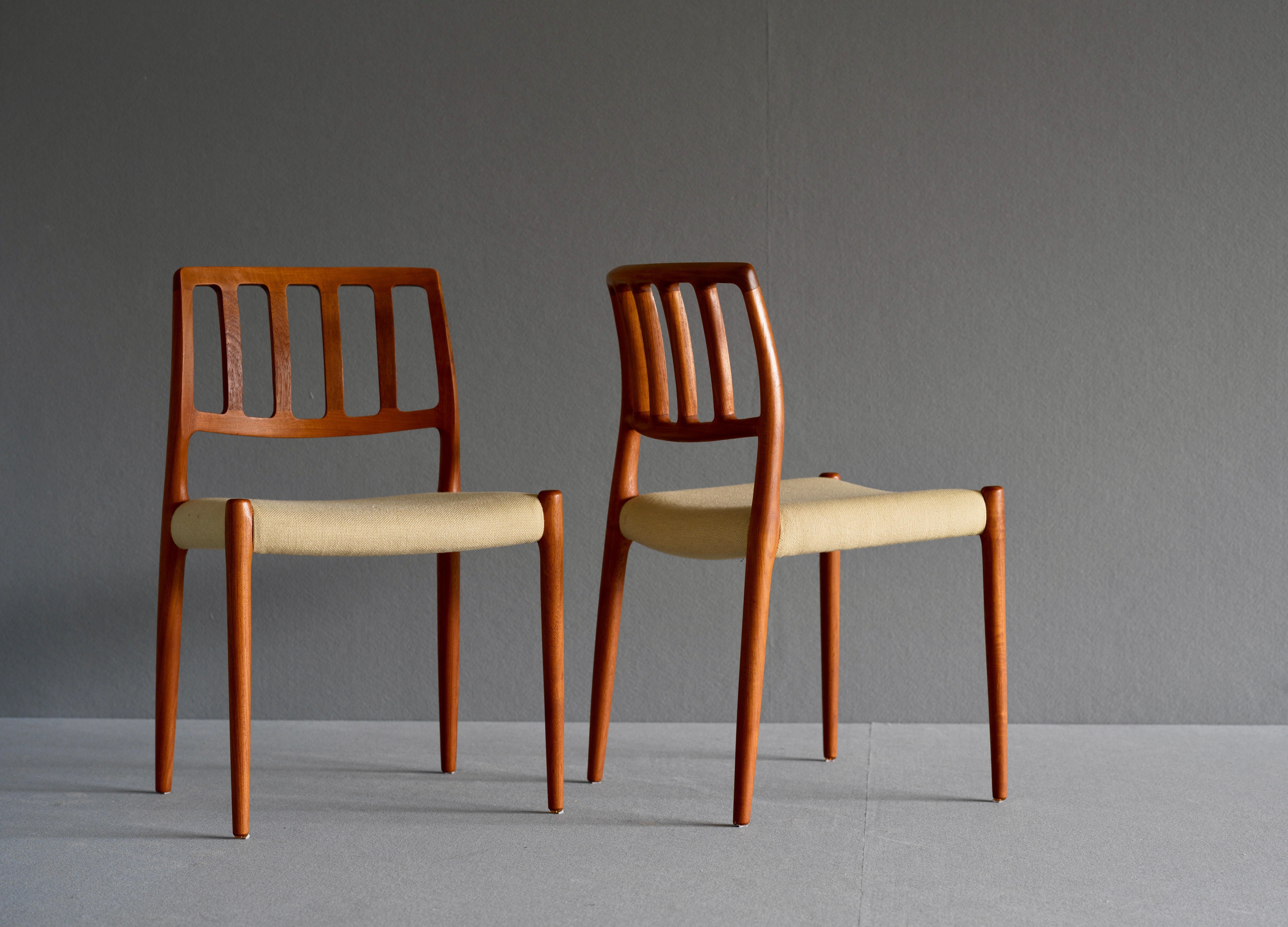 Chairs by Niels Moller for JL Møller. Moller’s designs are characterised by simple and timeless curves as evidenced by these chairs. They have a smoothly sculpted back and are in teak with wool upholstery. The solid teak frames have beautiful grain