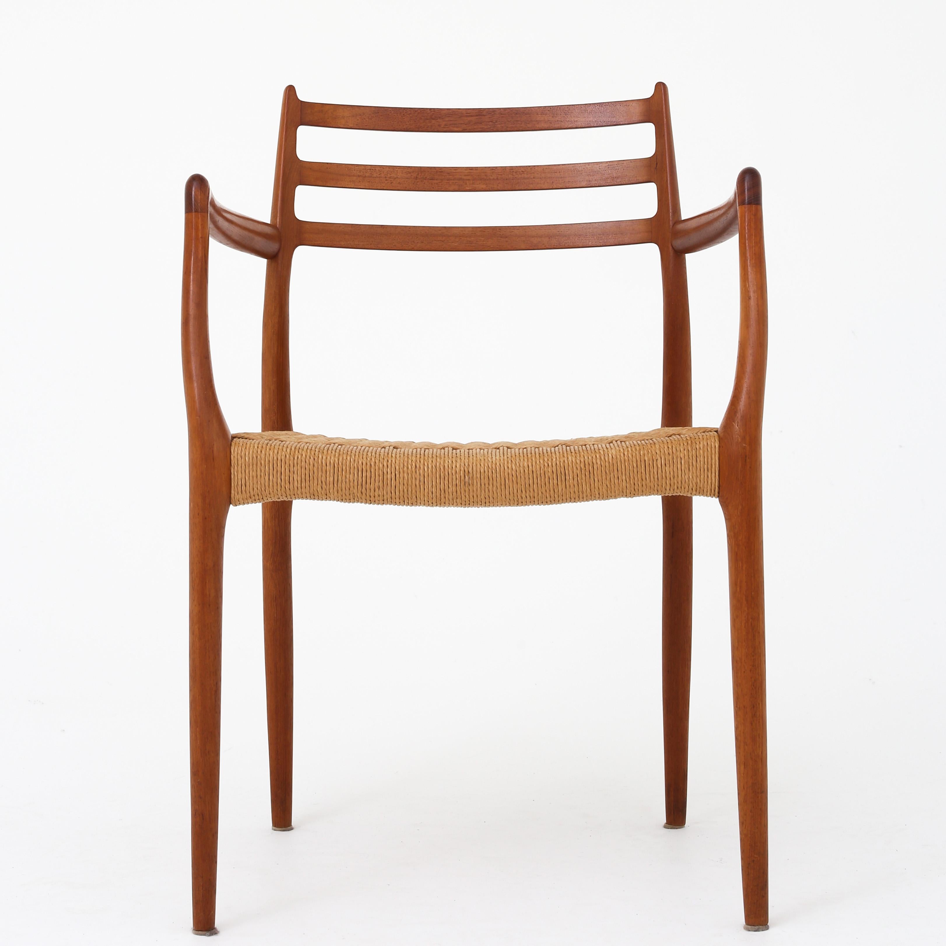 Niels O Møller / J.L Møller. NO 62 - Set of 6 armchairs in solid teak and seat in woven paper yarn. Designed in 1962.