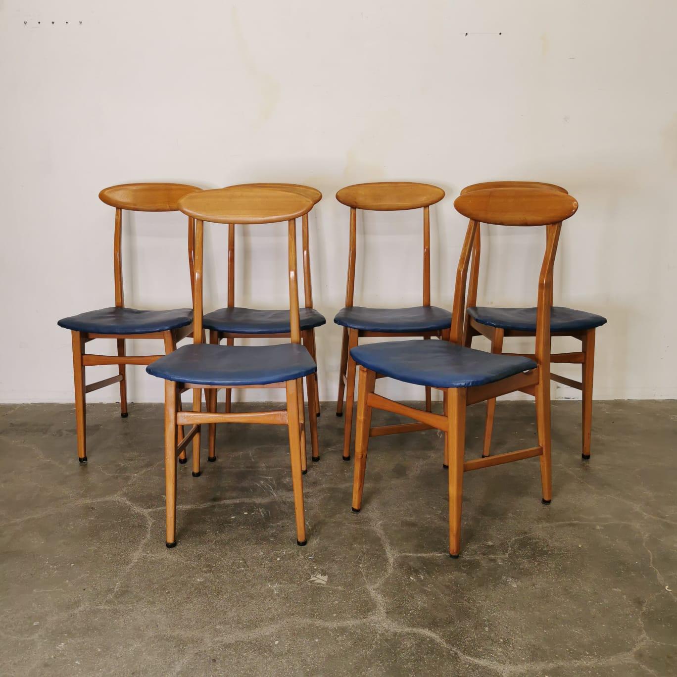 The set of six midcentury chairs by Sorgente del Mobile is a captivating ensemble that beautifully embodies the essence of the era. Crafted with meticulous attention to detail, these chairs showcase the perfect balance between form and