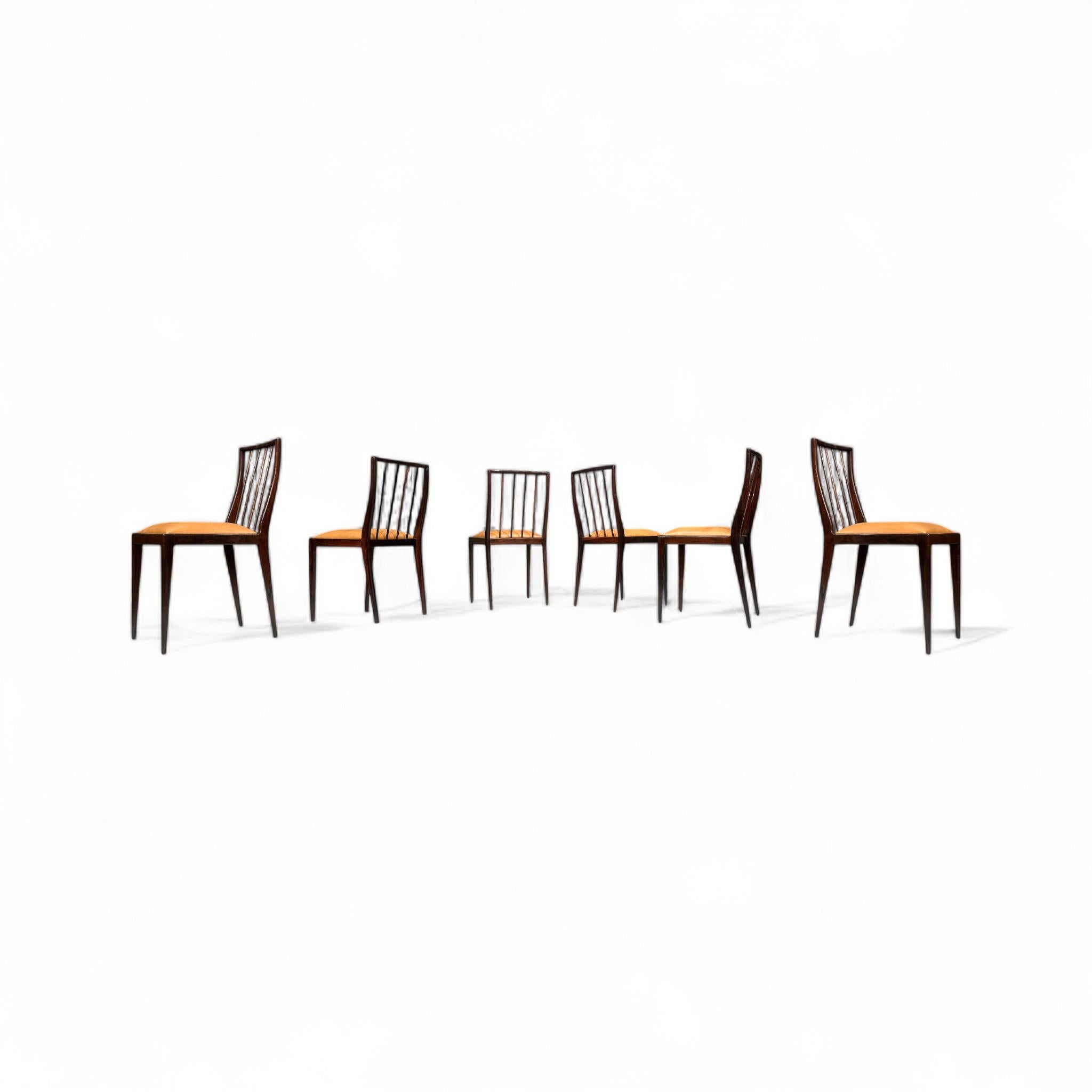 Designed by Geraldo de Barros for Unilabor in the late 1950s, these chairs embody a minimalistic and discreet aesthetic that exudes sophistication, making them ideal for an exclusive setting. The wooden frame has been expertly restored, and the