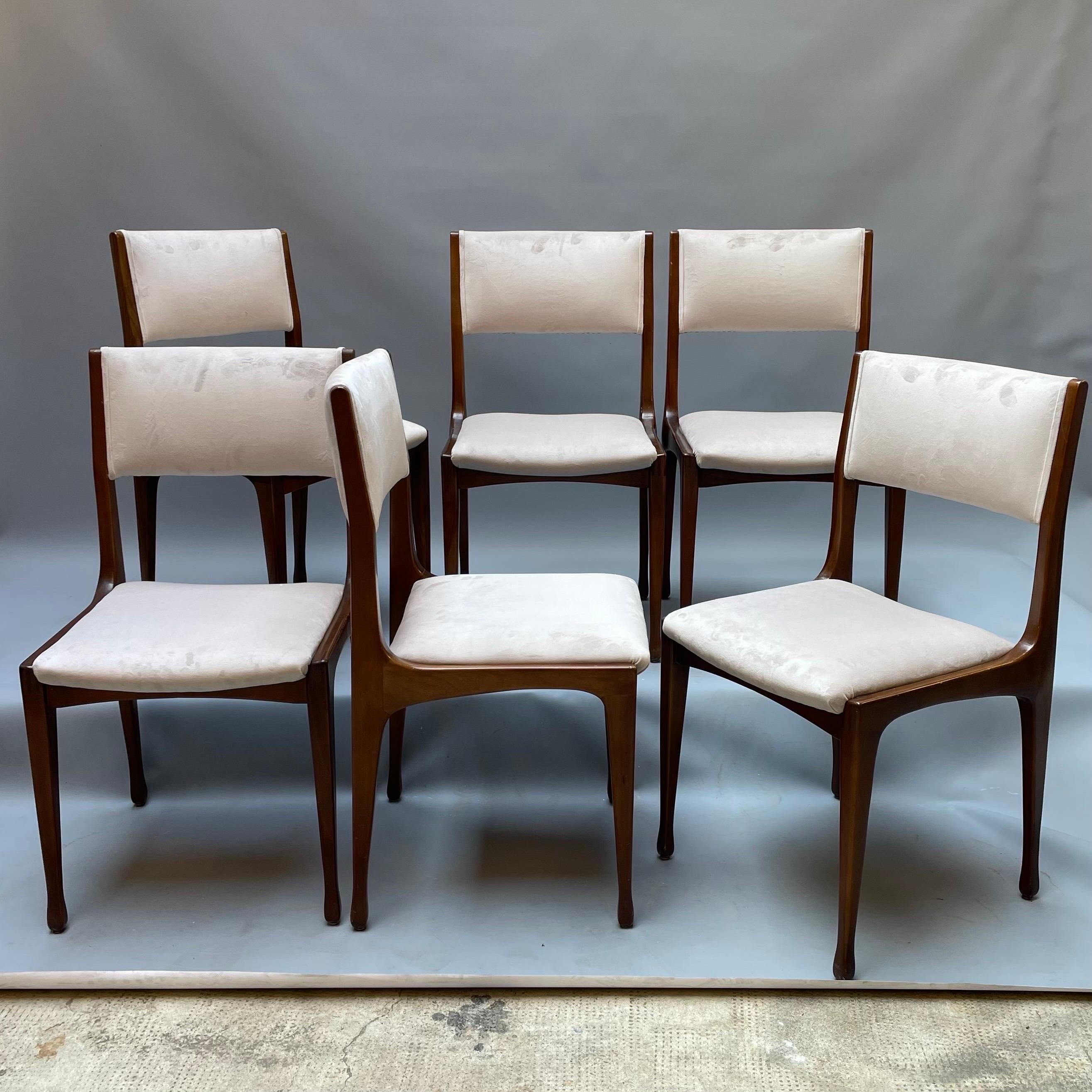 Chair model 693 production Cassina design Carlo de Carli, year 1958. Walnut wood frame, seat and back upholstered in rubber covered in warm white velvet. Carlo De Carli (Milan, 1910 – 1999) was, as well as a designer, promoter of Italian furniture,