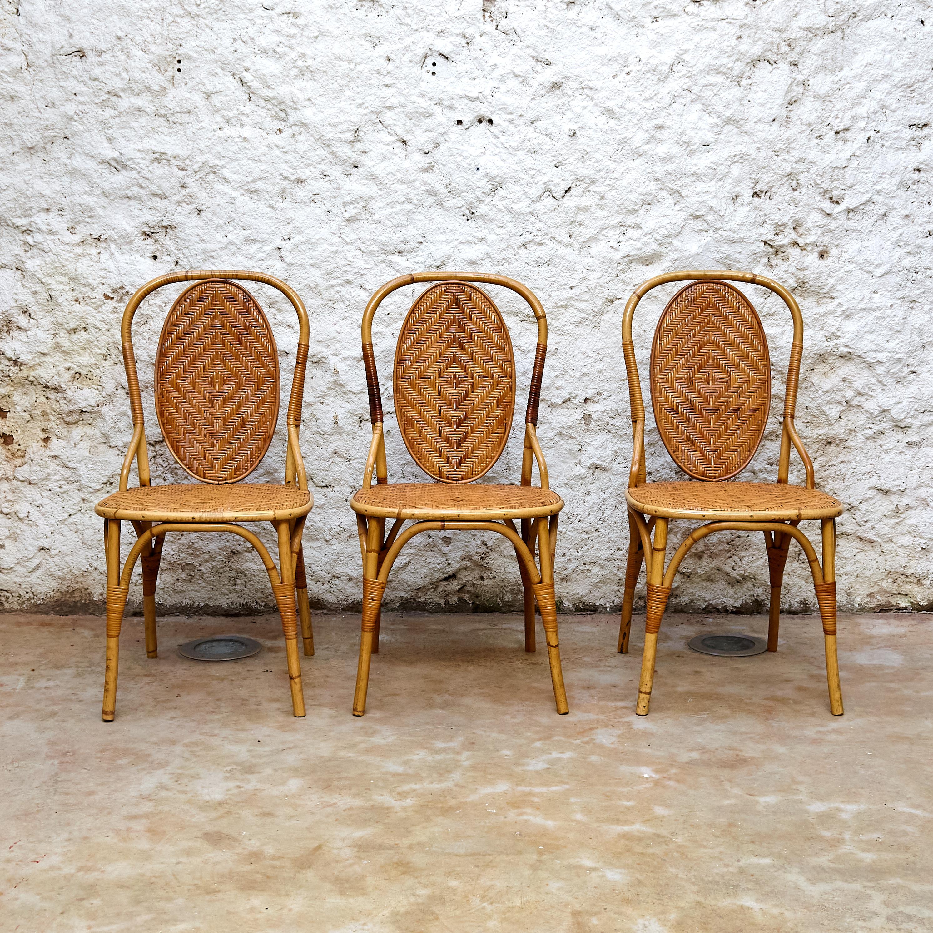 Set of 6 chairs Rombo by Miquel Mila 

Manufactured in Spain, circa 1968.

In original condition with minor wear consistent of age and use, preserving a beautiful patina.

Materials: 
Bamboo, rattan

Dimensions: 
D 52 cm x W 42 cm x H 85