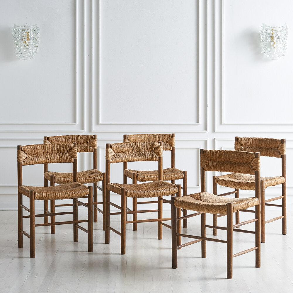 A set of 6 Charlotte Perriand Dordogne chairs for Sentou. Perriand (1903-1999) is considered to be one of the most important furniture designers of the mid-20th century. Jean Prouve was noted to have said that she was among the rare designers