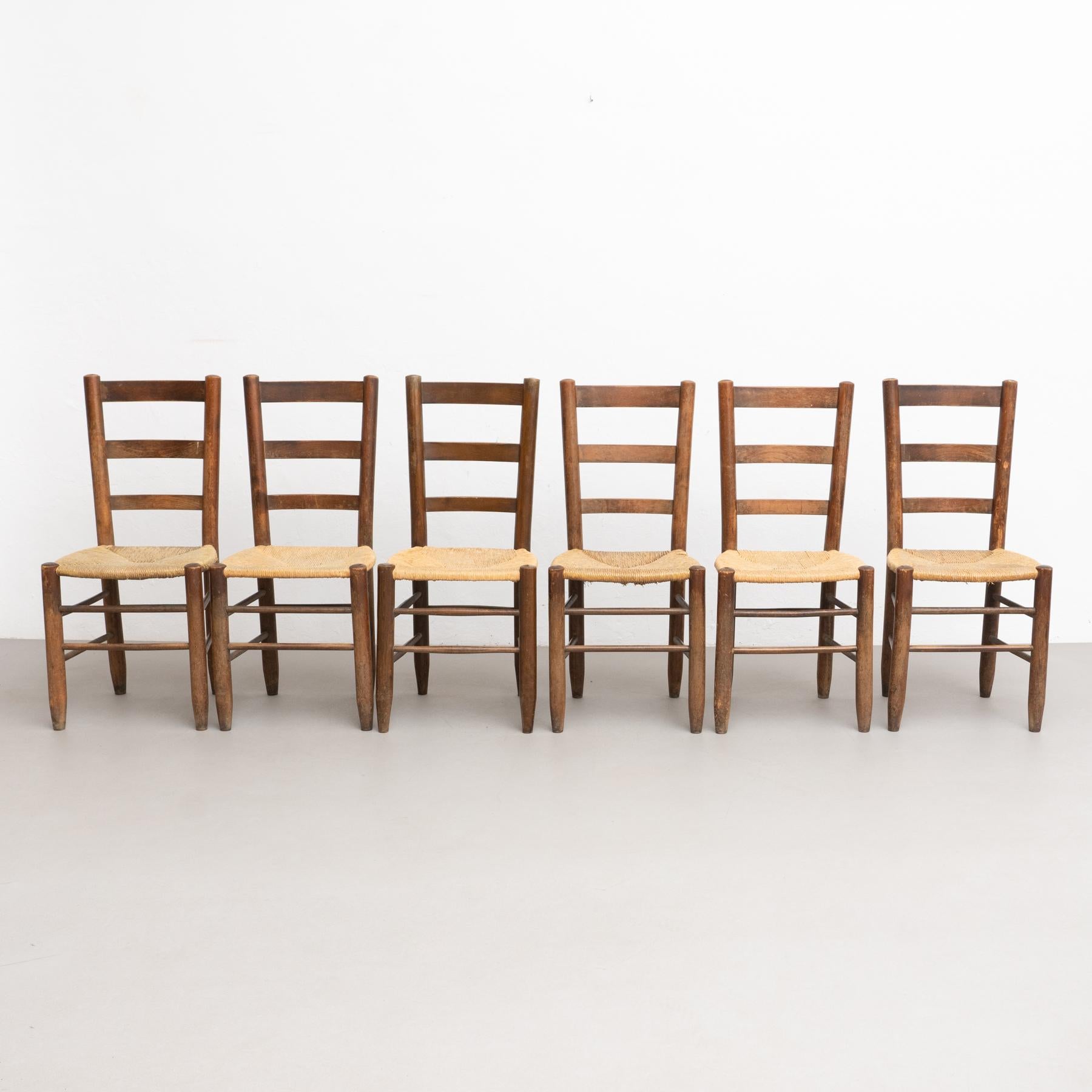 Set of 6 n.19 chair designed by Charlotte Perriand, made by unknown manufacturer.

Circa 1950, France.

Materials
Beech wood.
Rattan.

In good original condition, with minor wear consistent with age and use, preserving a beautiful patina.