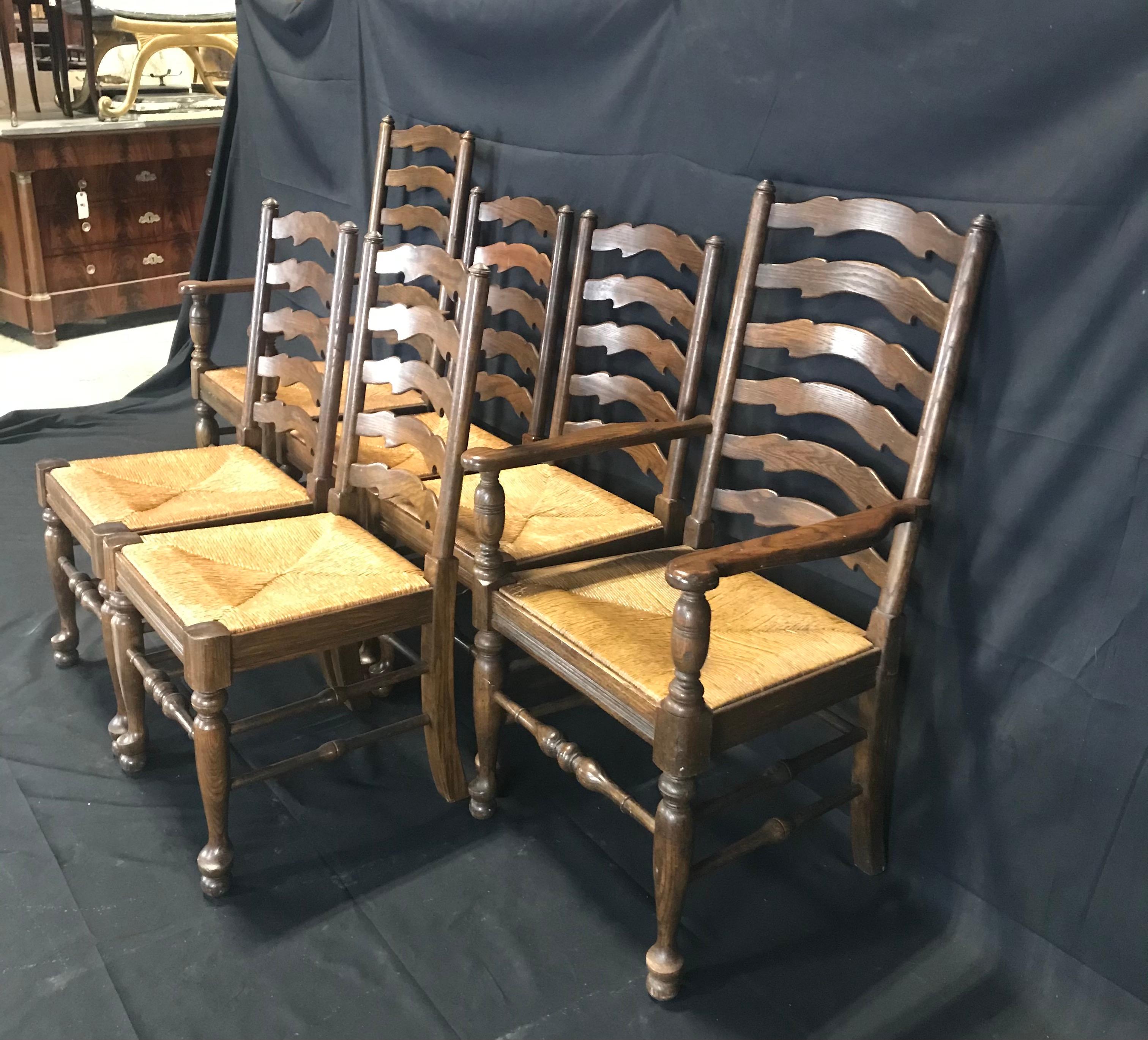 A wonderful set of six super high quality English wavy ladder back chairs just waiting for everyday use in a country kitchen. Really adds elegance and visual punch to the Classic ladder back style. There are two armchairs and 4 sides, all very