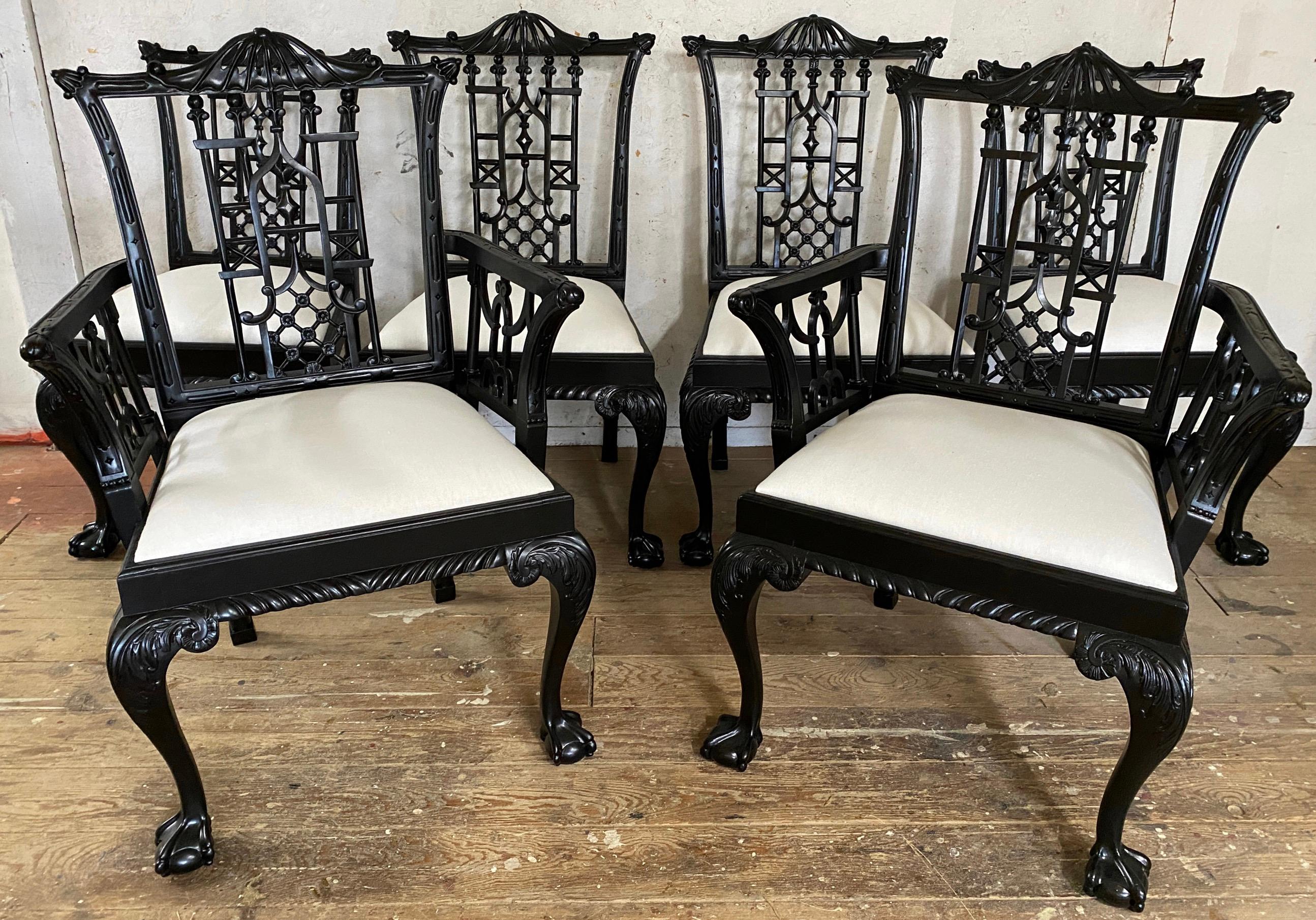 A very handsome set of 6 English, Chinese Chippendale ebonized carved mahogany chairs -- 2 arm chairs and 4 side chairs with open fretwork, ball and claw feet, upholstered slip seats.  The carvings are beautifully articulated on the pierced  back.