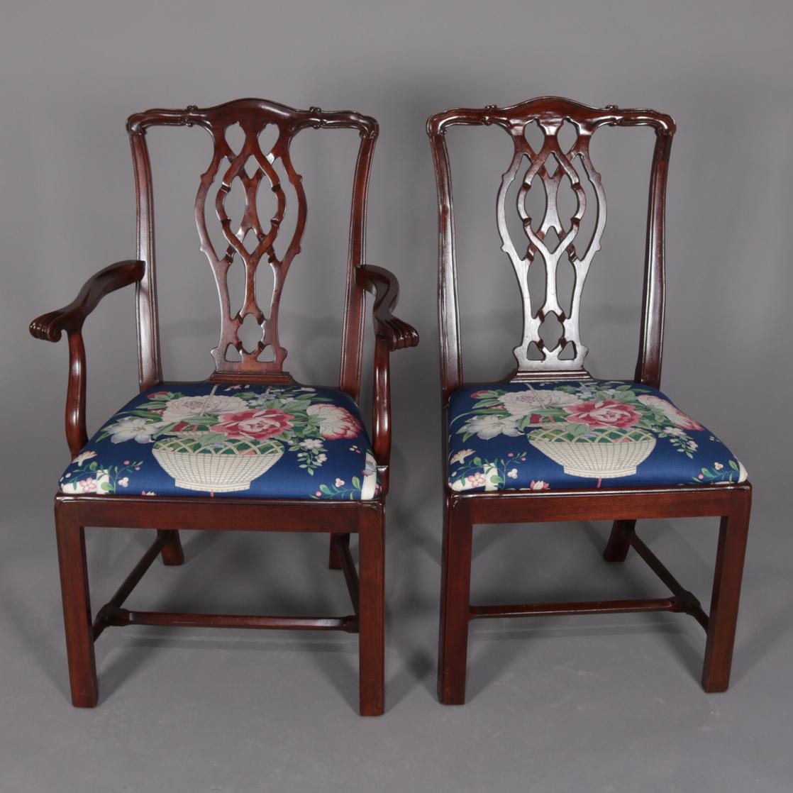 Set of 6 Chippendale style dining chairs feature mahogany frames with ribbon backs and upholstered seats; set includes two armchairs and two side chairs, circa 1940.

Measures: Side chairs 38.5