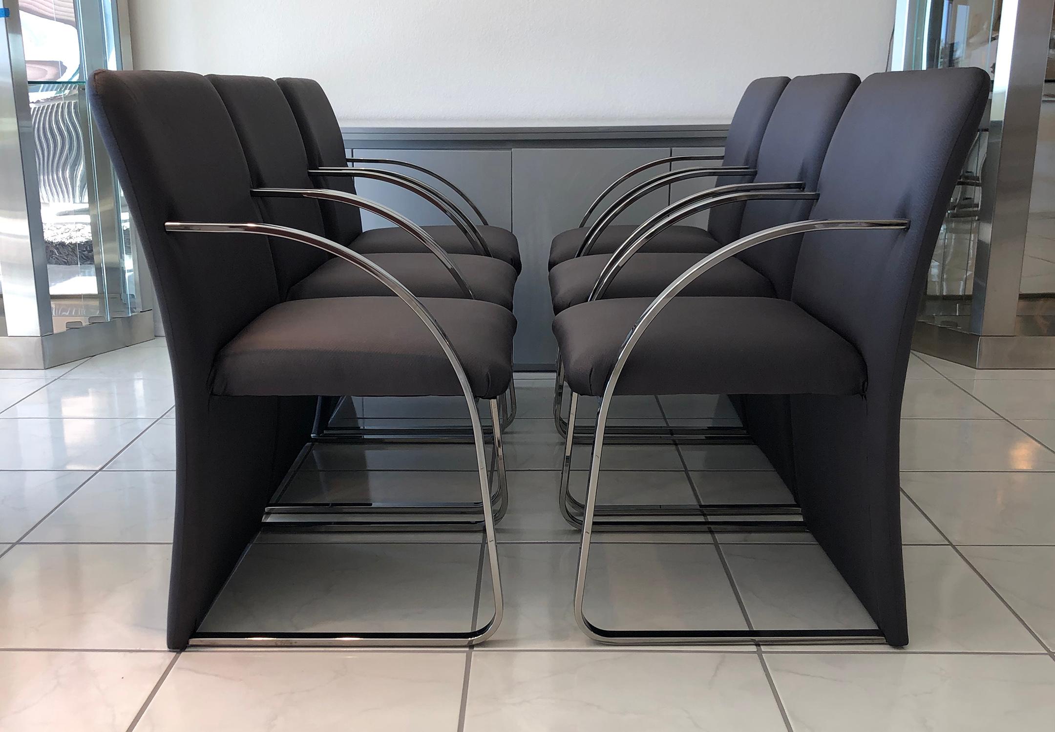An absolutely stunning set of 6 chrome, post modern dining chairs by Rougier. These upholstered and chrome dining chairs feature fully upholstered backs with front chrome legs and arms. 

This sleek and modern design is evocative of Milo Baughman