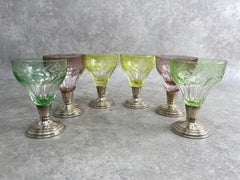 Set of 6 colored cut glasses on silver stems