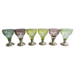 Set of 6 colored cut glasses on silver stems