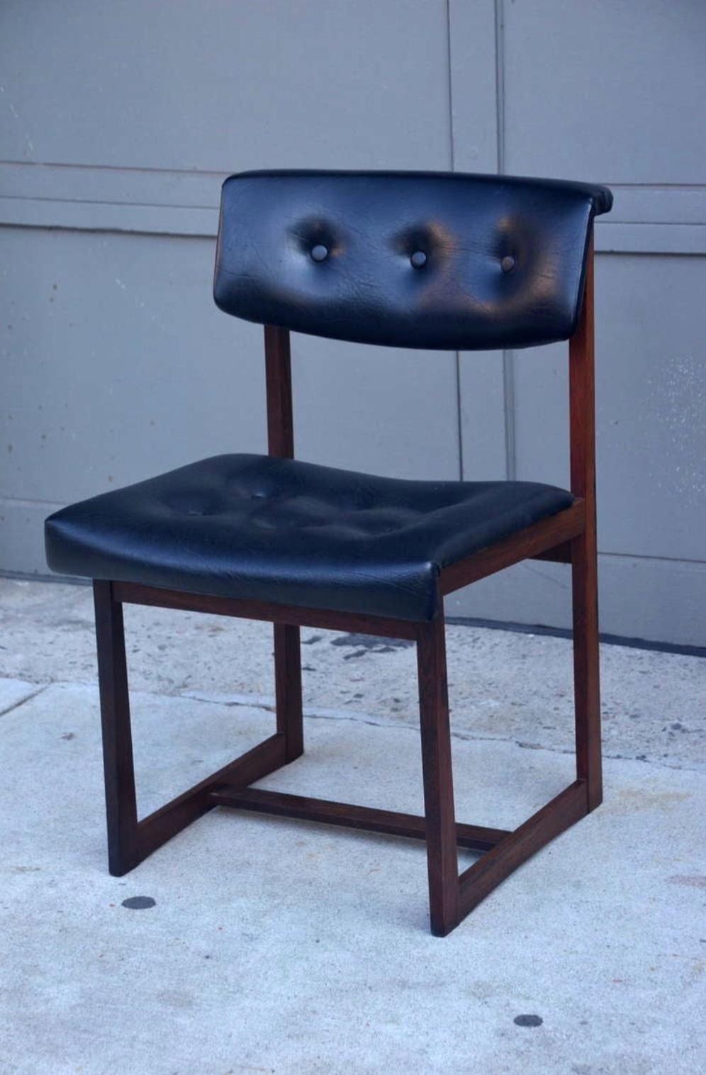 Set of 6 Comfortable Brazilian Rosewood Chairs. Sturdy angled Brazilian rosewood frames, original black vinyl upholstery.