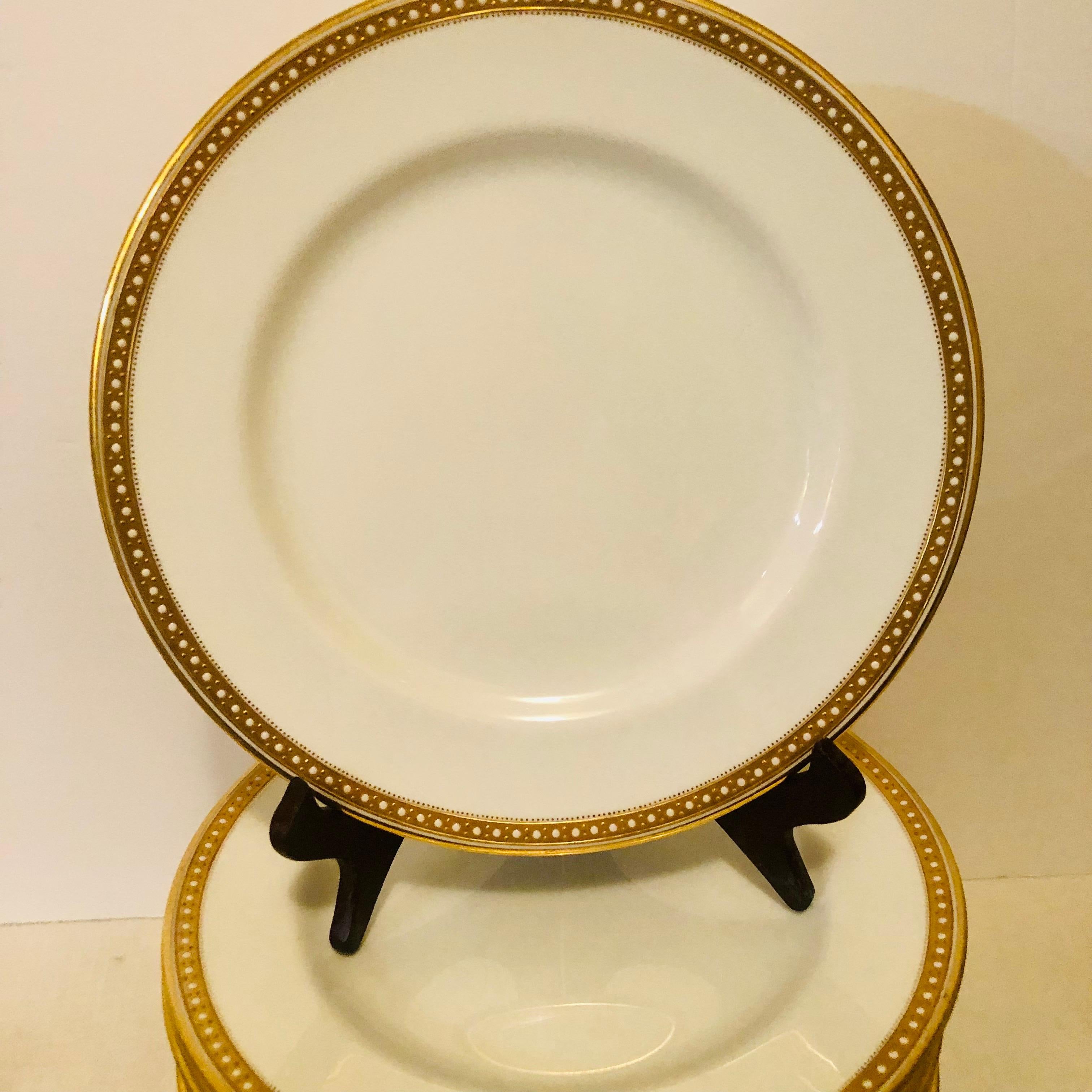 I am offering you this exquisite set of six Copeland Spode dinner plates which have a gold border and white enamel jeweling on a white porcelain body. They definitely look like simple elegance, and they would look beautiful with any dinnerware you