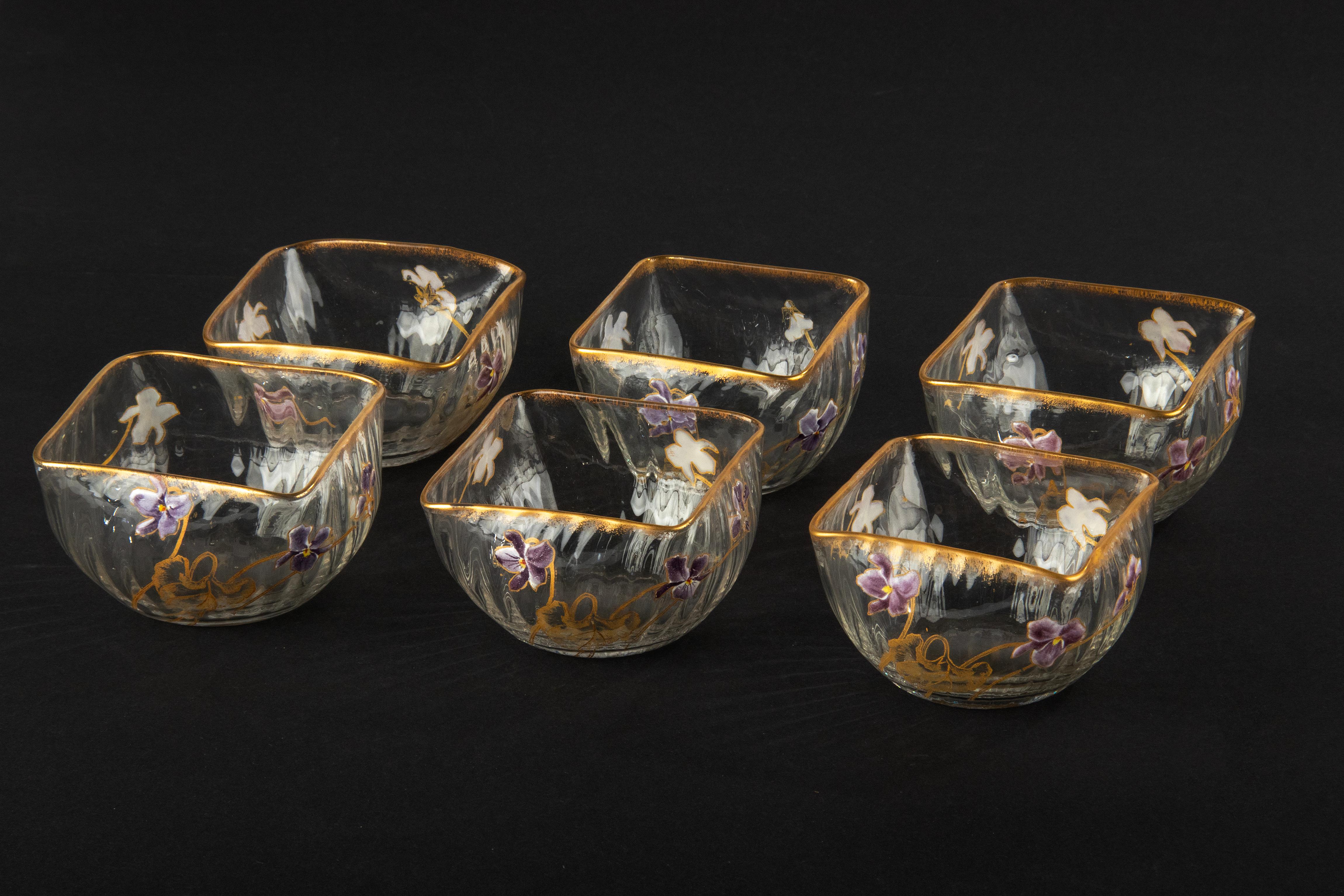 A lovely set of 6 crystal bowls, attributed to the French manufacturer Daum Nancy. The bowls are beautifully painted with flowers and gold-coloured accents, entirely in Art Nouveau style. The bowls are not marked, but the shape of the bowls, the
