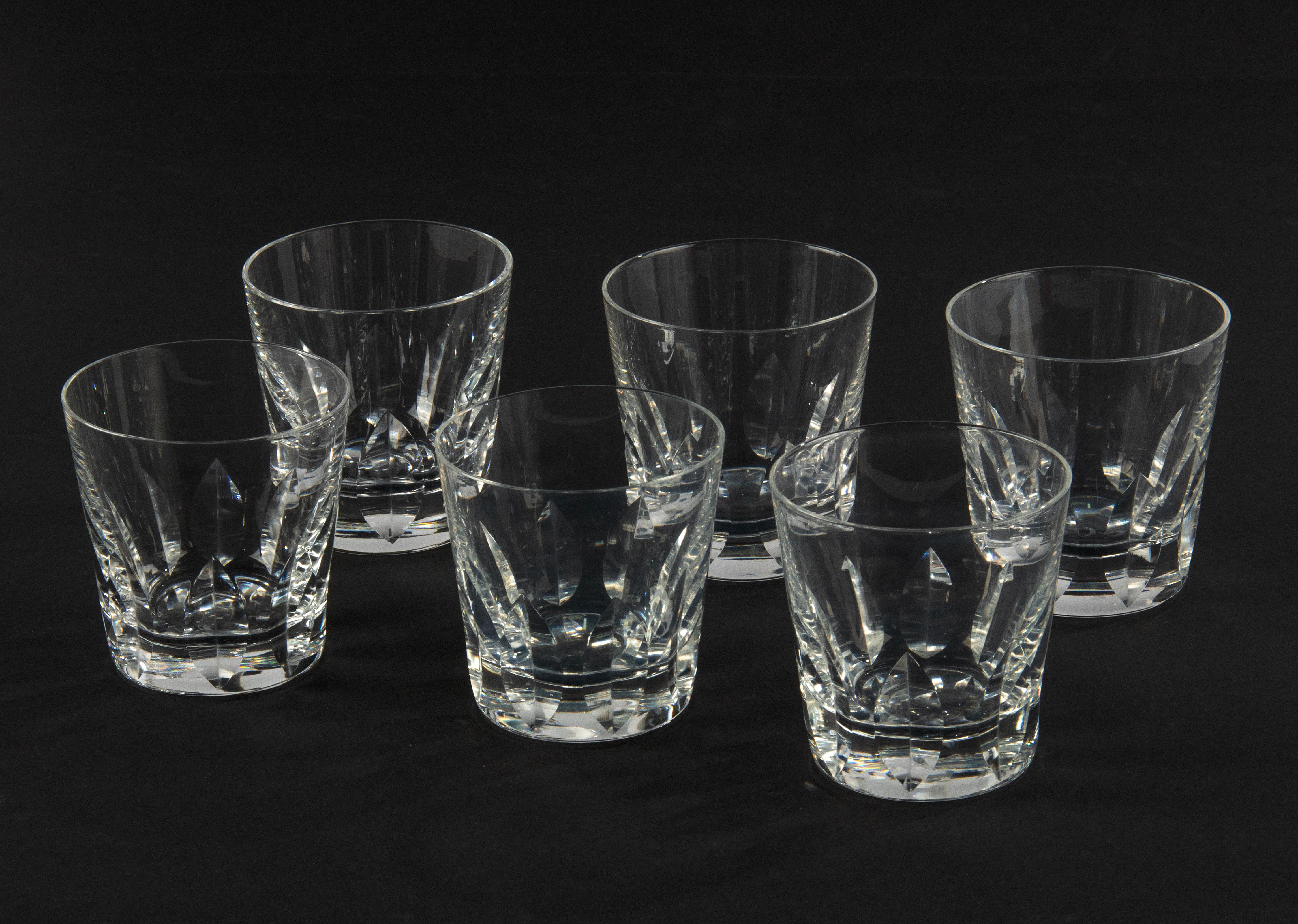 Set of 6 classic crystal whiskey glasses from the French brand Saint Louis. The glasses have a beautiful leaf-shaped cut, the name of the model is Jersey. The glasses date from circa 1970. They are all marked on the bottom in the middle, and they