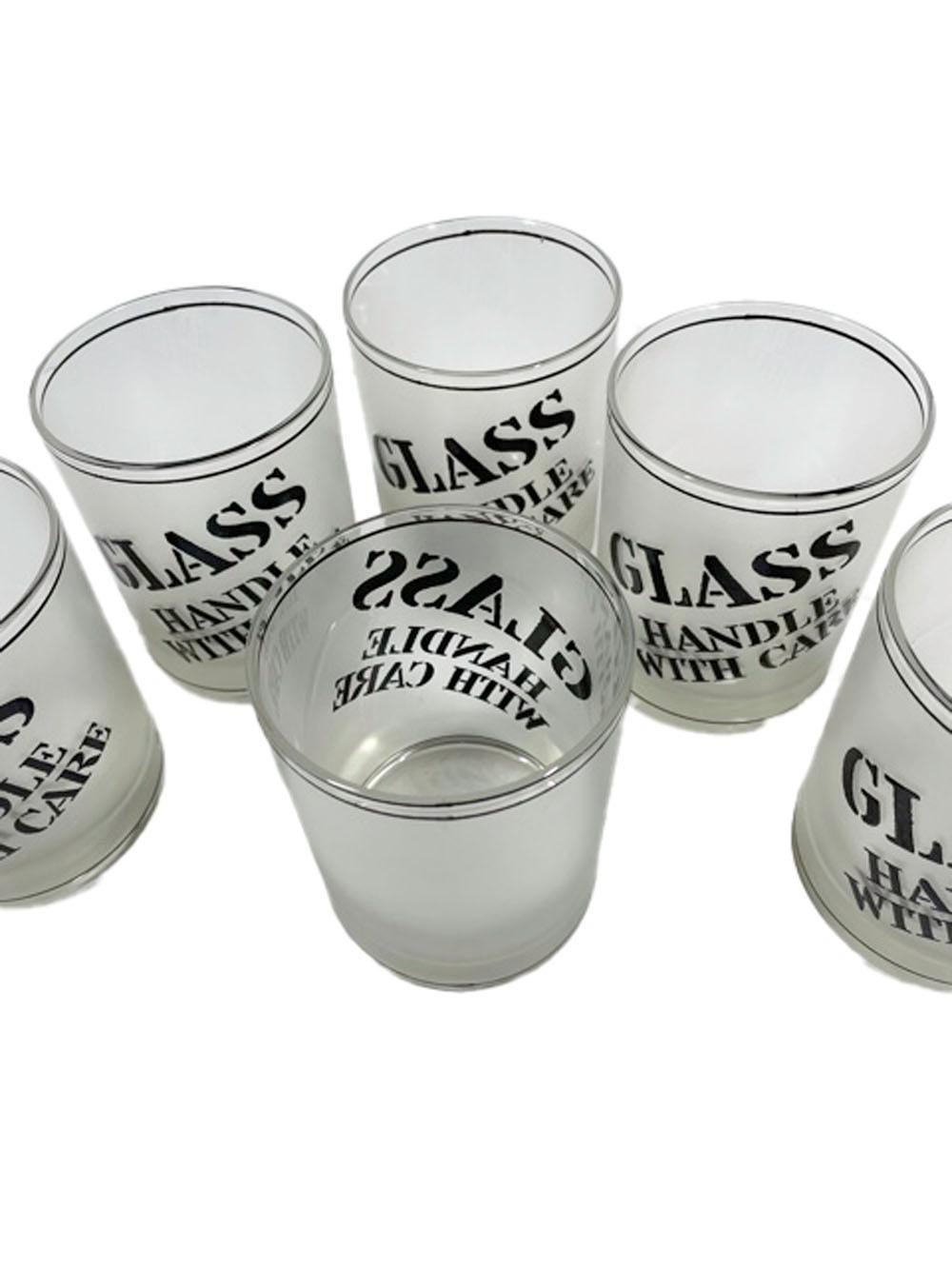 Six Mid-Century Modern rocks glasses by Culver LTD. With the words 
