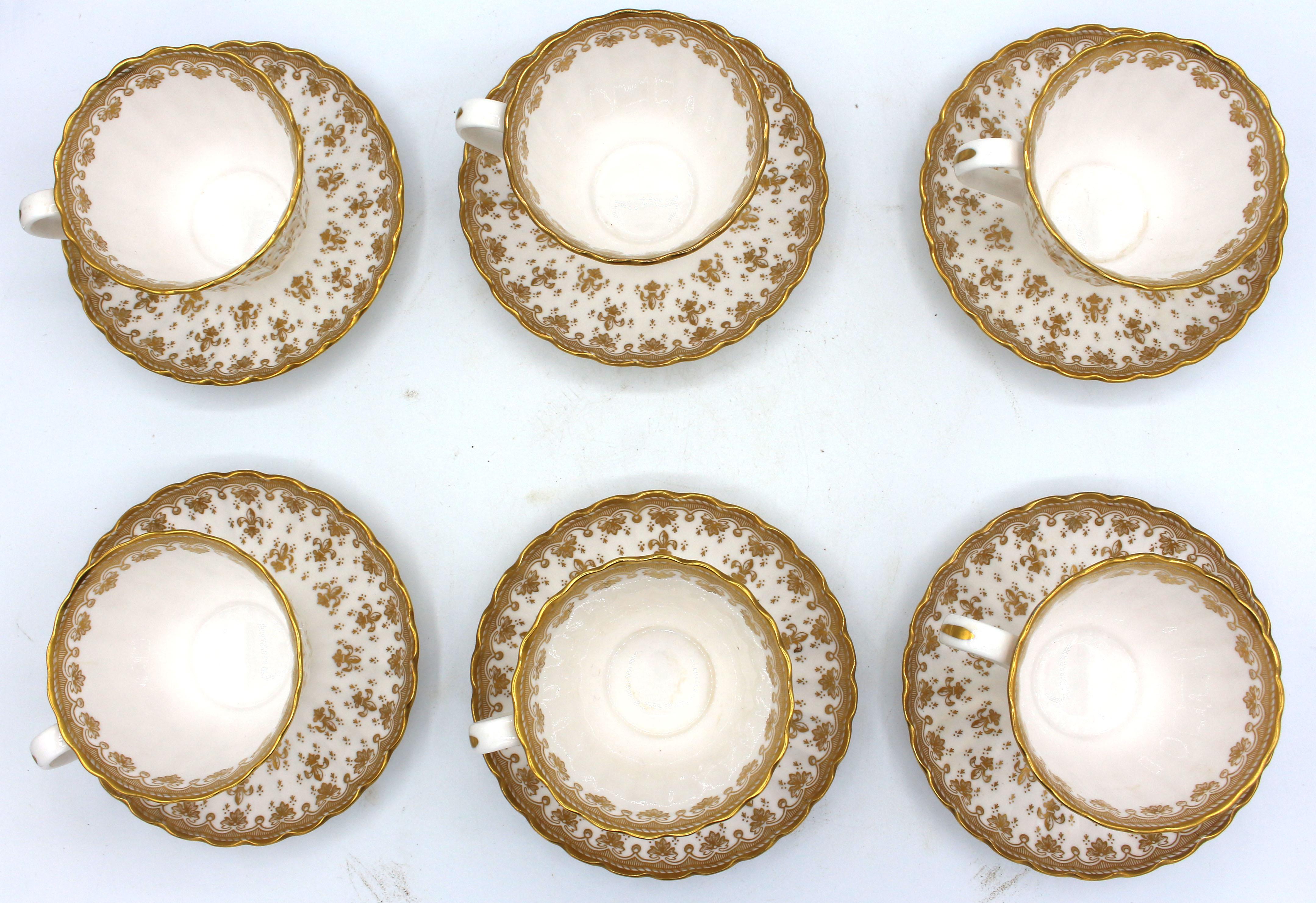 Set of 6 Cups & Saucers, Spode's Fleur de Lys Gold, Mid-20th century, bone china. Fine gilt decoration. Discontinued pattern. Flat with elegantly flared body. Fine condition.
Cup: 2.75