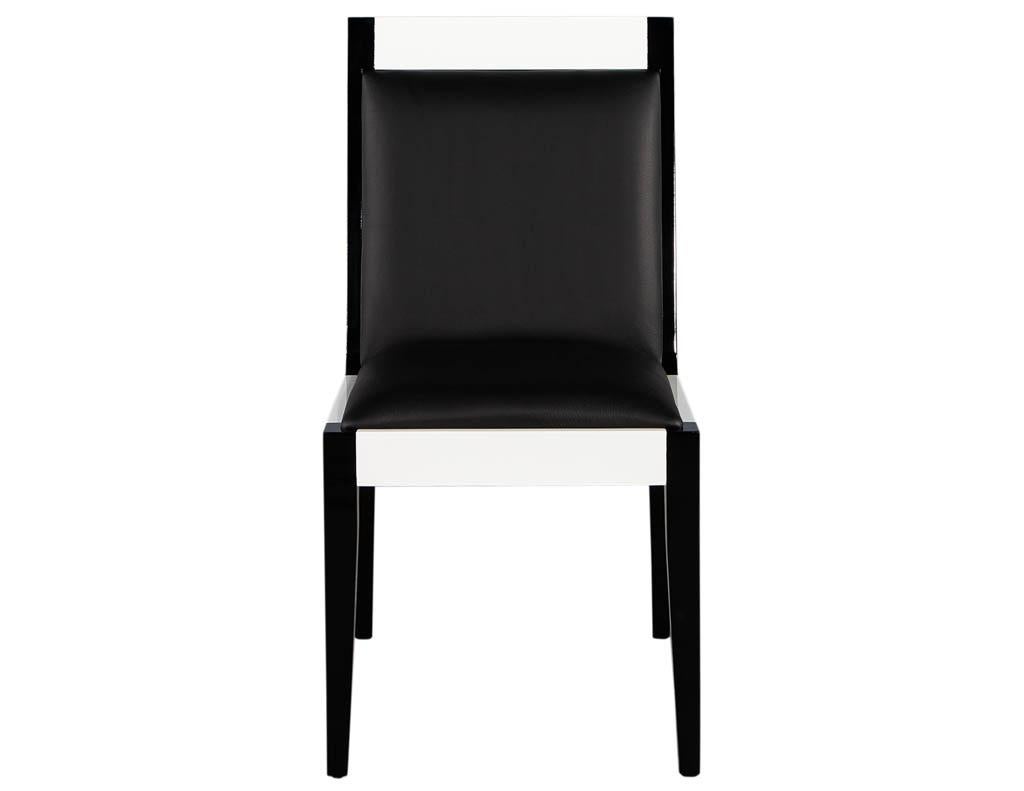 Set of 6 custom black and white leather dining chairs by Carrocel. Featuring sleek modern styling with contrasting black and white polished lacquer finish. Completed in luxurious Italian black leather. Price includes complimentary curb side delivery