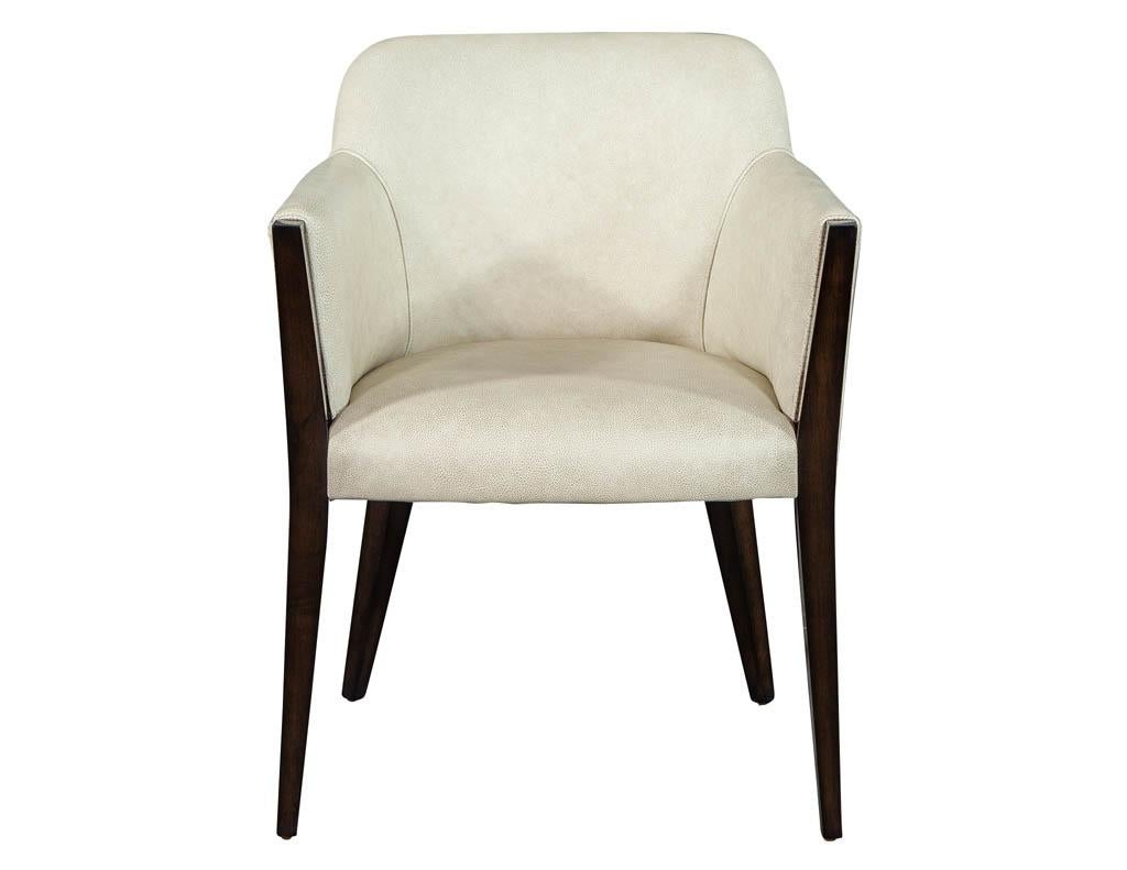 Set of 6 custom modern leather dining chairs by Carrocel. Finished in a rich high gloss walnut color complimented by a beautifully textured taupe beige Italian leather. Custom options available per request.

Price includes complimentary curb side