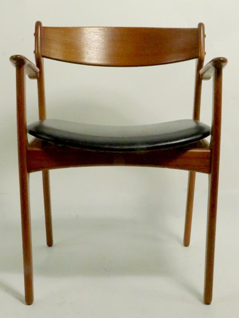 Nice set of Danish modern teak dining chairs designed by Erik Buch for Oddense Maskinsedkeri. This set includes two arm chaios and four side chairs, all are in very fine, original condition, clean and ready to use.
Arm chair dimensions: Total H