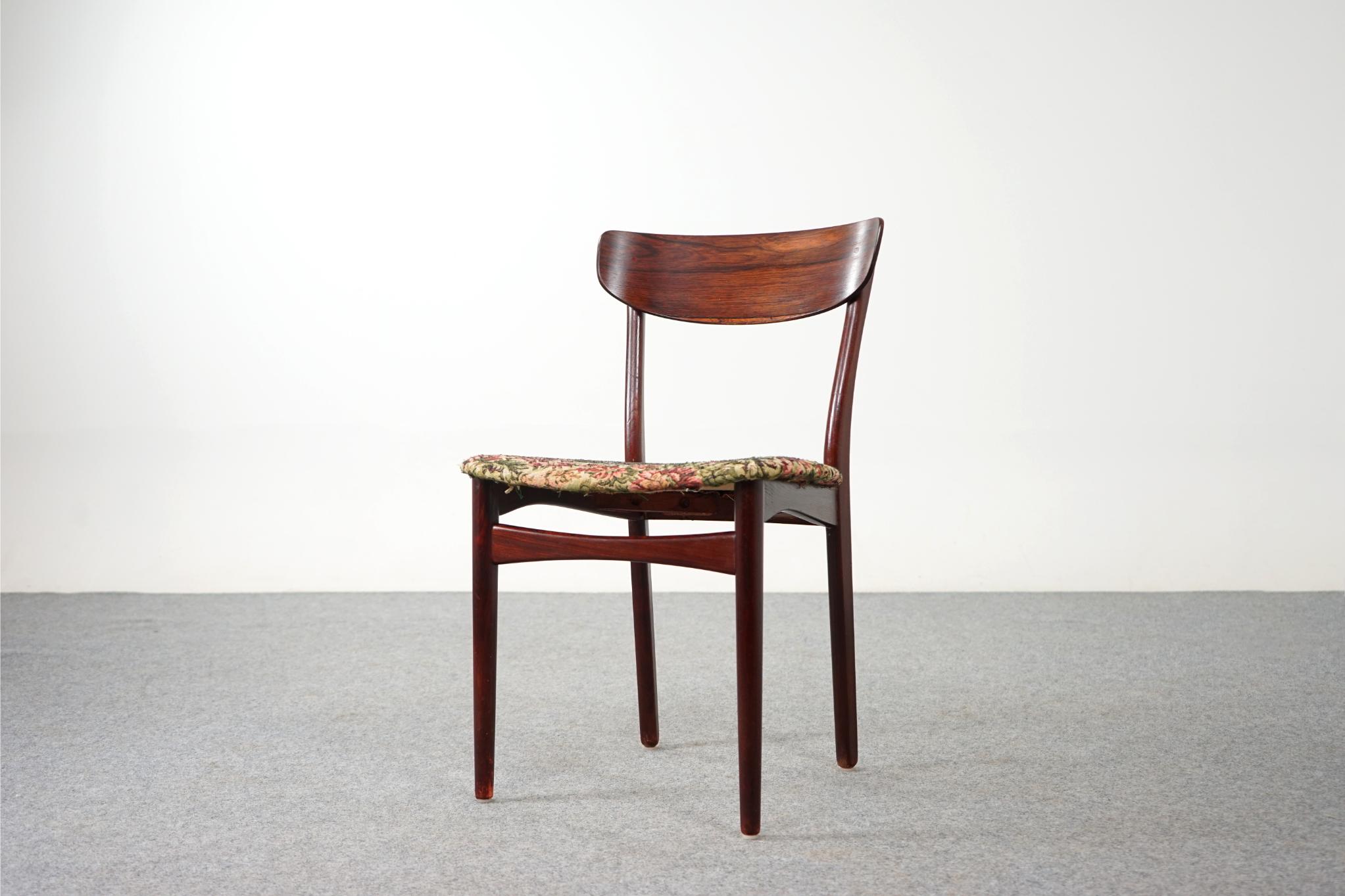 Rosewood Danish dining chairs, circa 1960's. Beautifully curved rosewood backrests and generous seat design provide support and comfort. Solid beechwood stained legs feature cross braces for added stability and support. Removable seat pad makes
