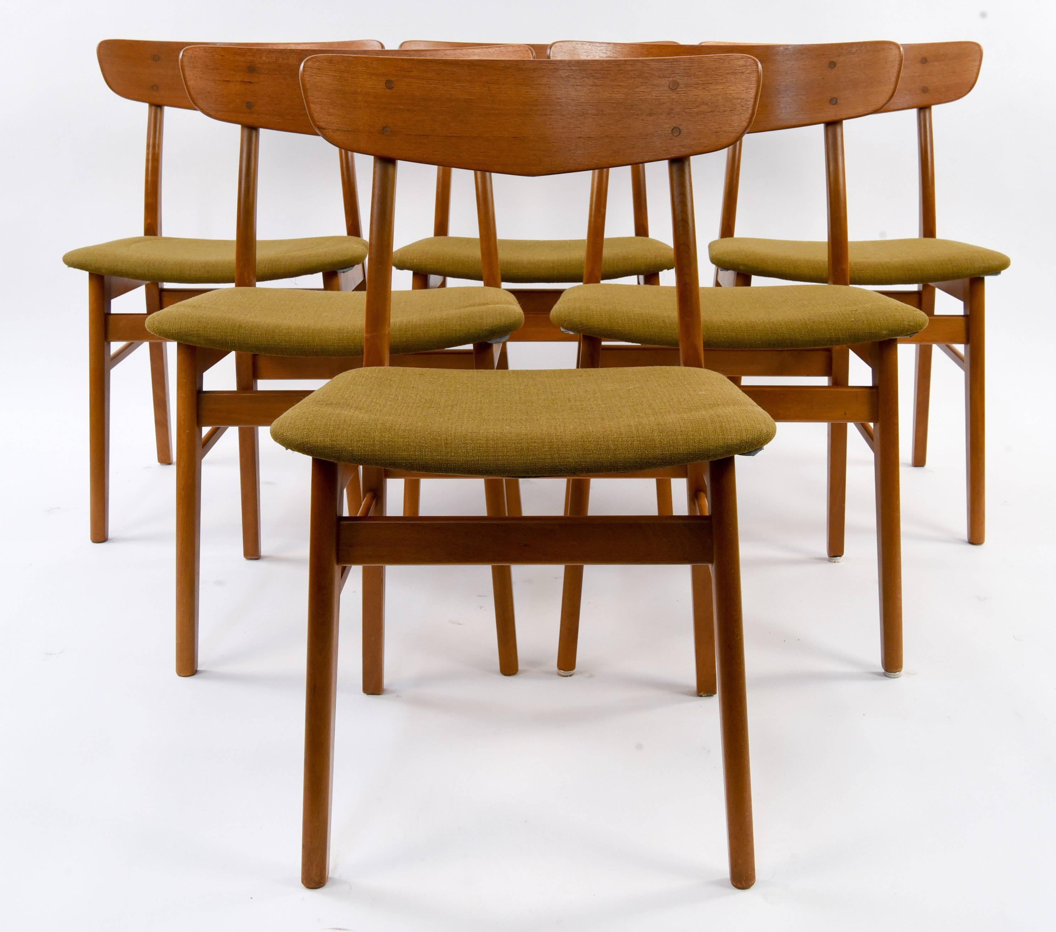 This set of six dining or side chairs would look great around a table. Made by SAX, circa 1960s. Great Danish form made of teak wood.